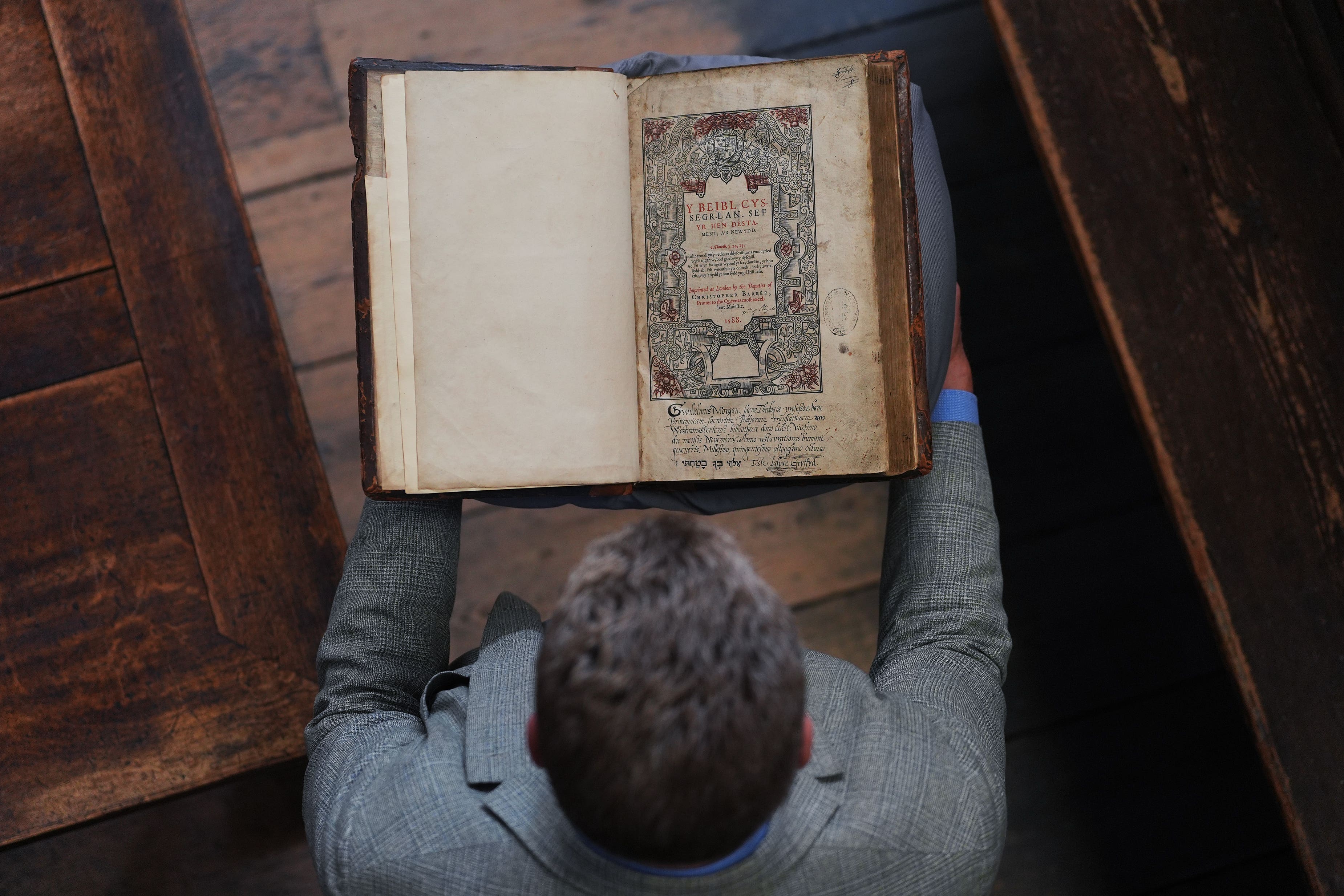 Dr Tony Trowles, head of the Abbey Collection, with a rare first edition of the Welsh Bible (Yui Mok/PA)