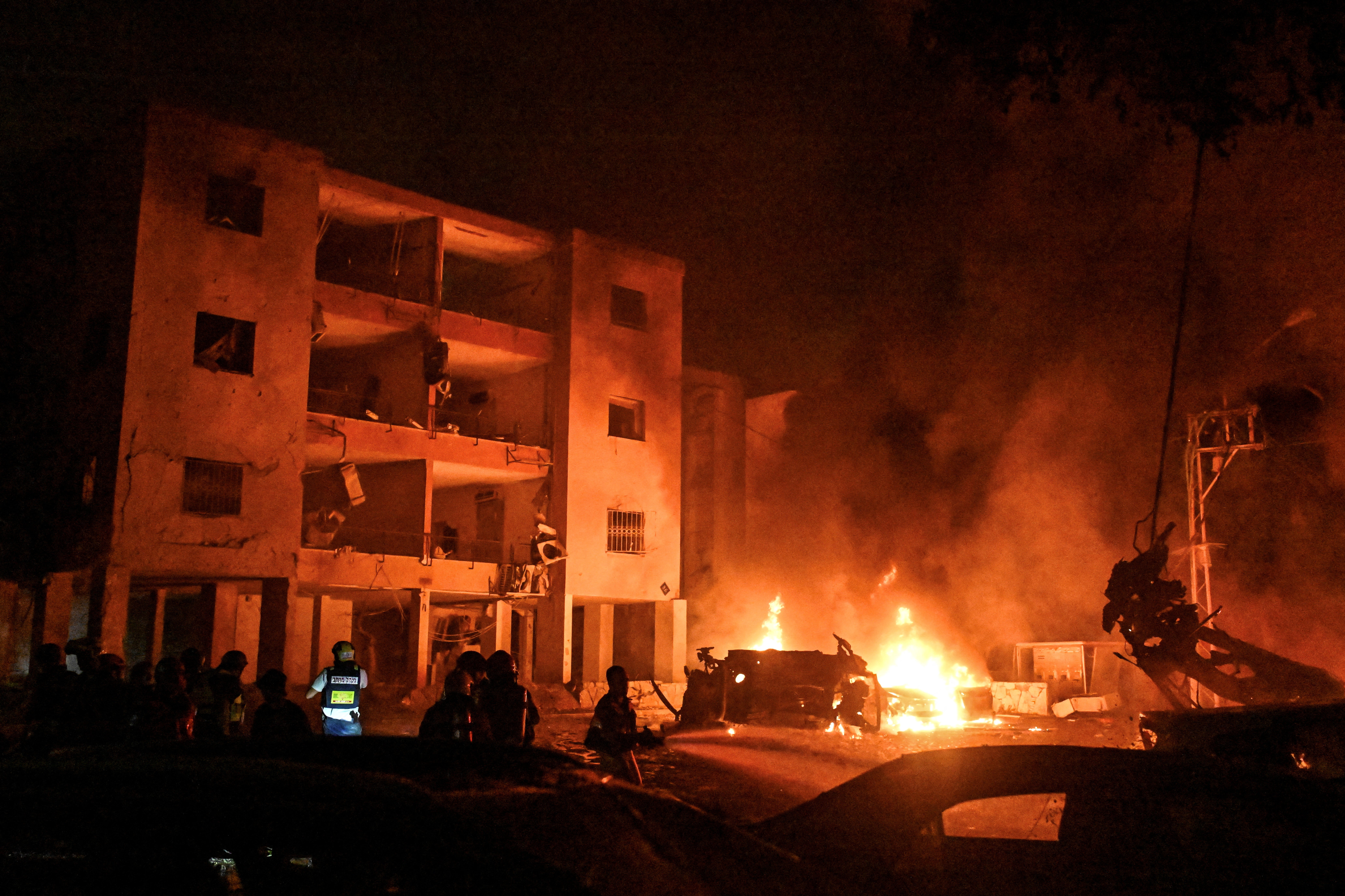 Firefighters and rescue teams respond to a fire following a missile attack in Haifa. The conflict escalated over the weekend after Israel’s surprise attack on Iran on Friday