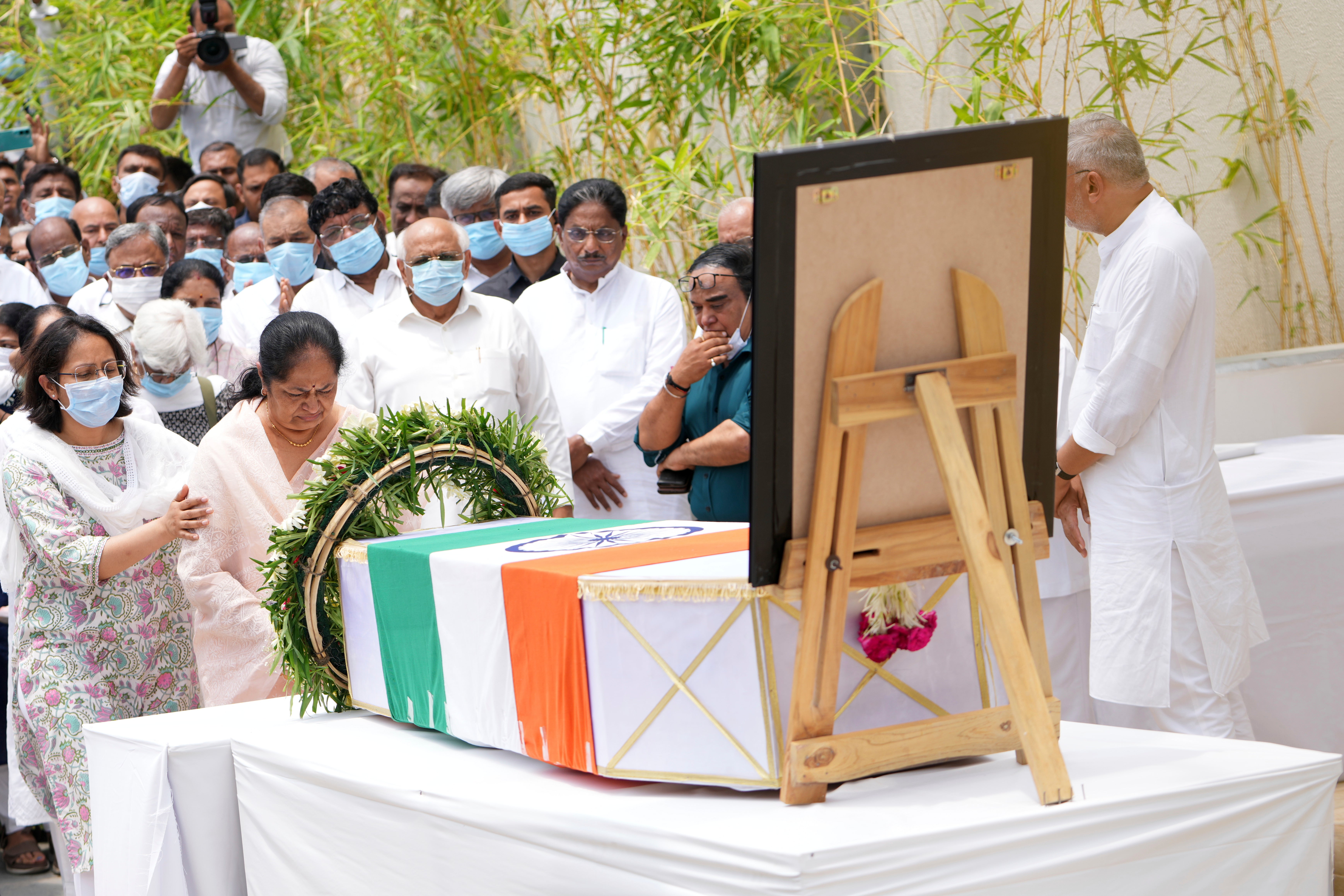 Anjali Rupani, second left, wife of former Chief Minister of Gujarat Vijay Rupani, victim of Thursday's Air India plane crash, pays respect after receiving his body at a hospital in Ahmedabad, India, Monday, June 16, 2025