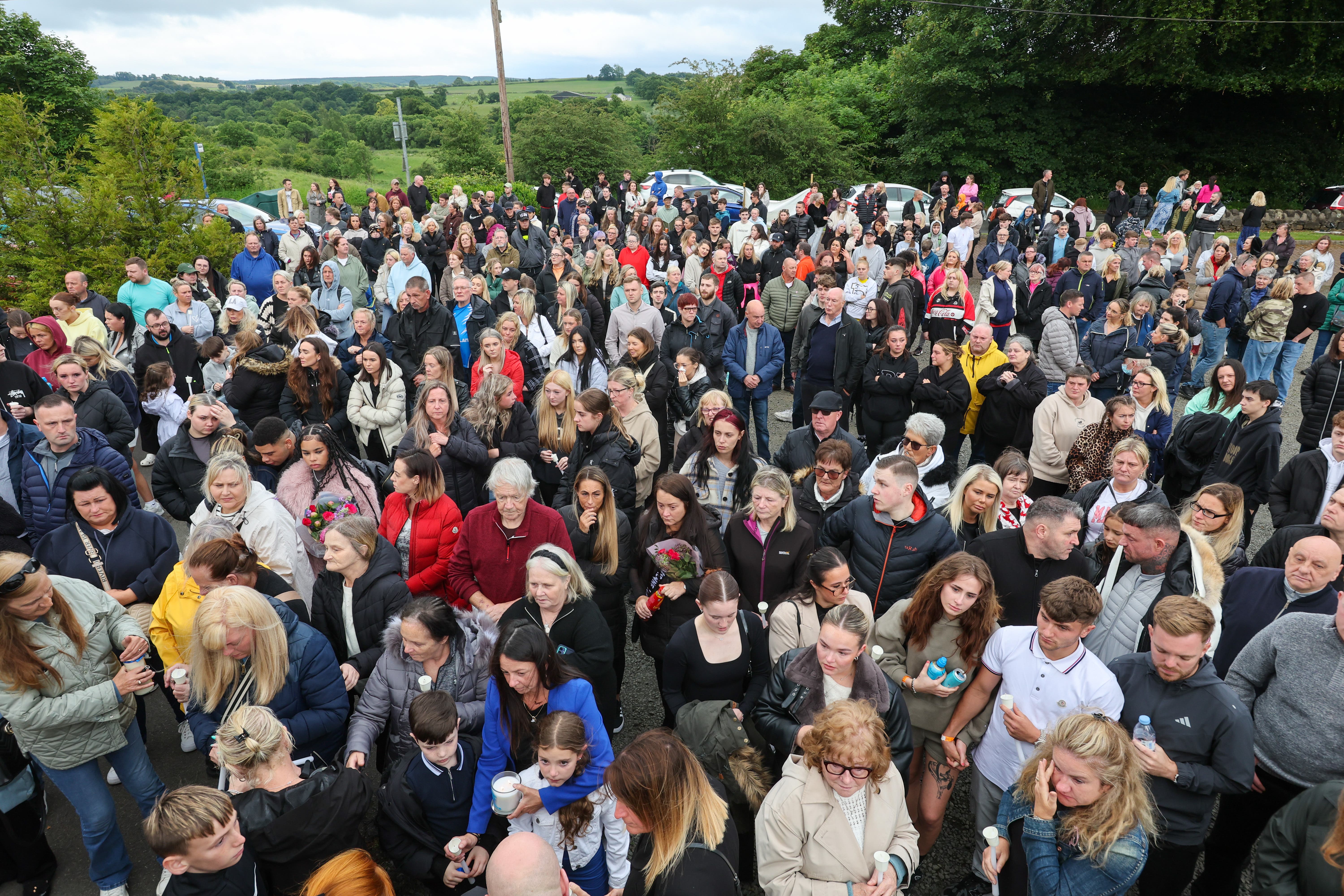 People attend a vigil at the Glenskirlie Hotel in Banknock, for Cole Cooper (Robert Perry/PA Wire)