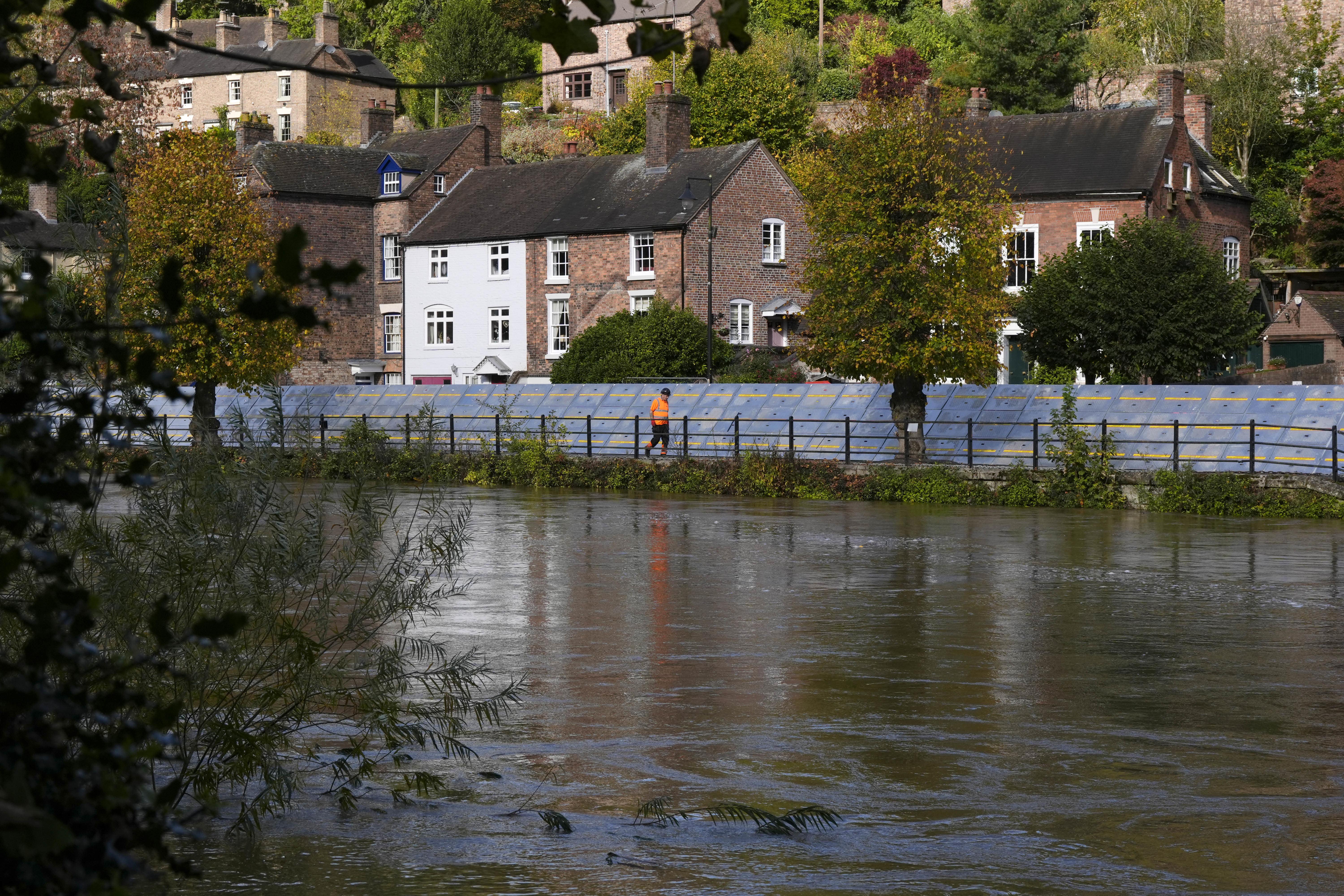 Flood defences were put in place along the wharfage next to the River Severn at Ironbridge in Telford in October last year (Nick Potts/PA)