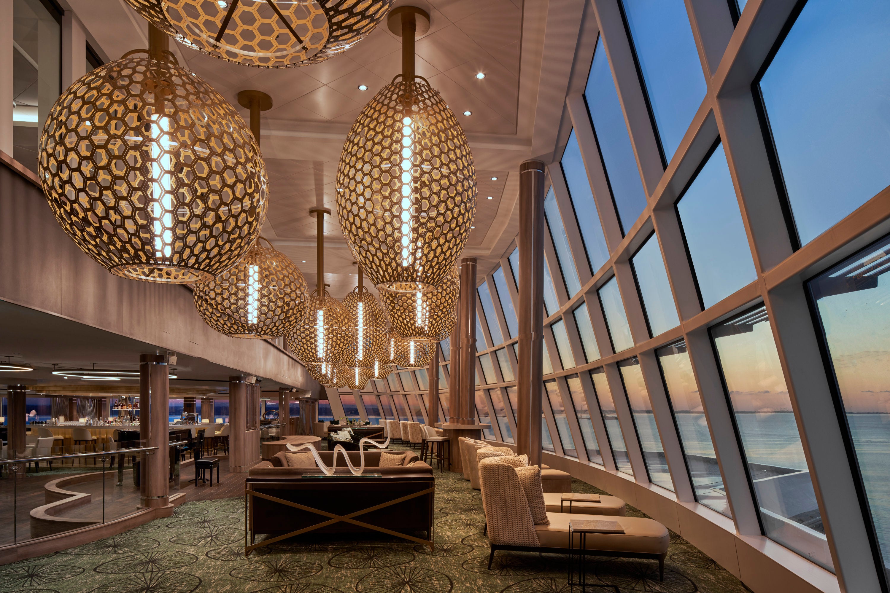 The Observation Lounge on board Norwegian Cruise Line's Norwegian Encore offers floor-to-ceiling sea views