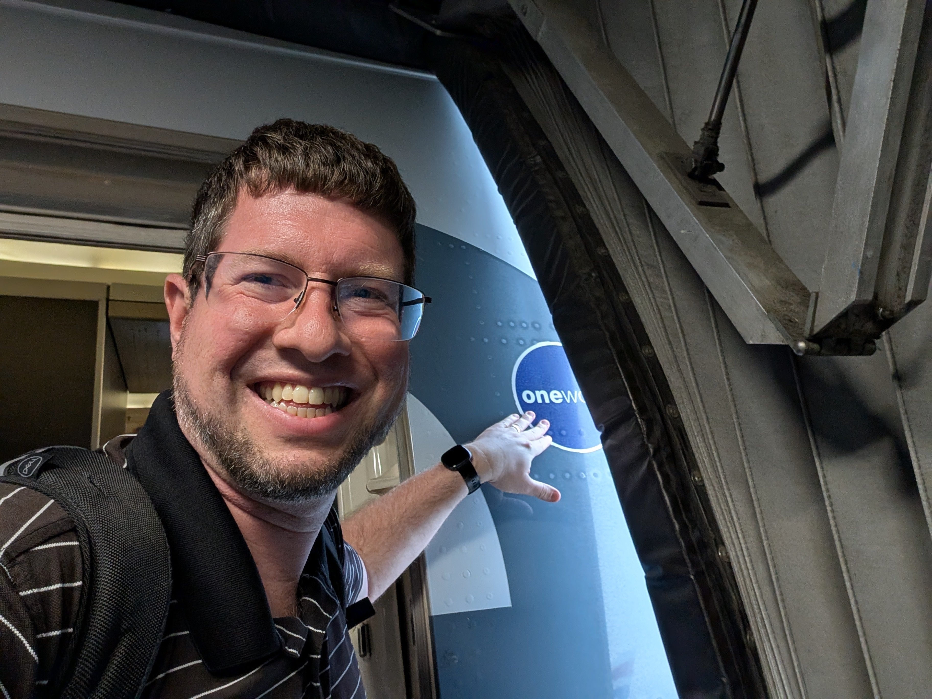Mr Genter, pictured about to enter the American Airlines plane he was eventually removed from