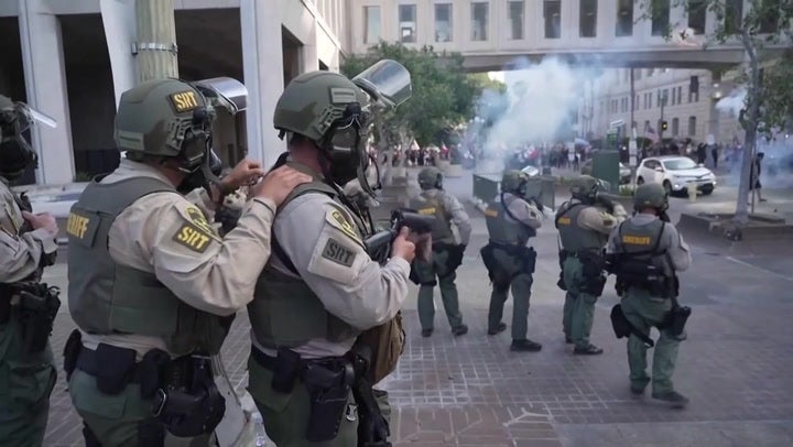 Police use tear gas on anti-Trump protesters in LA