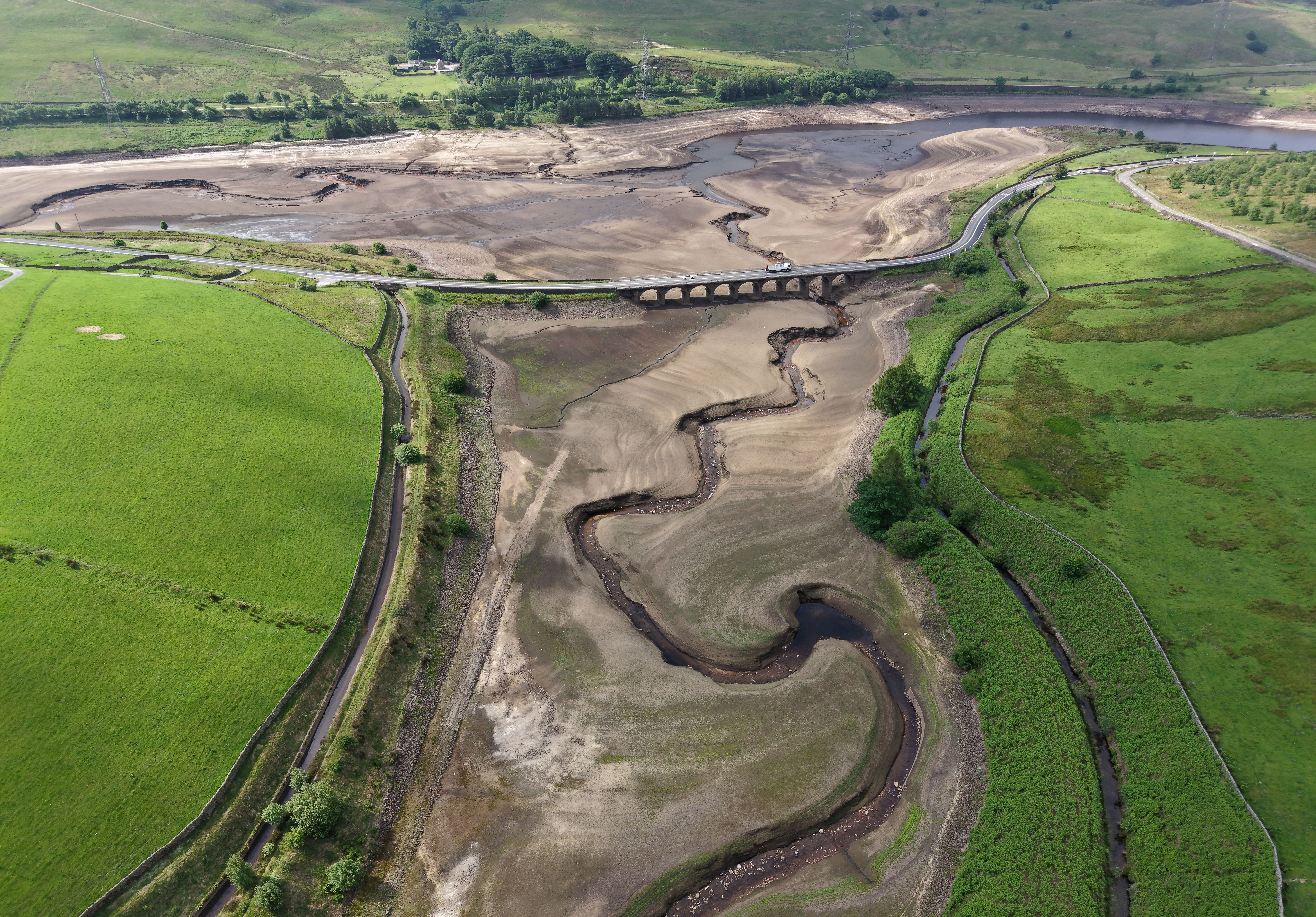 A drone image showing Woodhead Reservoir in north Derbyshire, highlighting the impact on supplies through the lack of rain water levels in spring