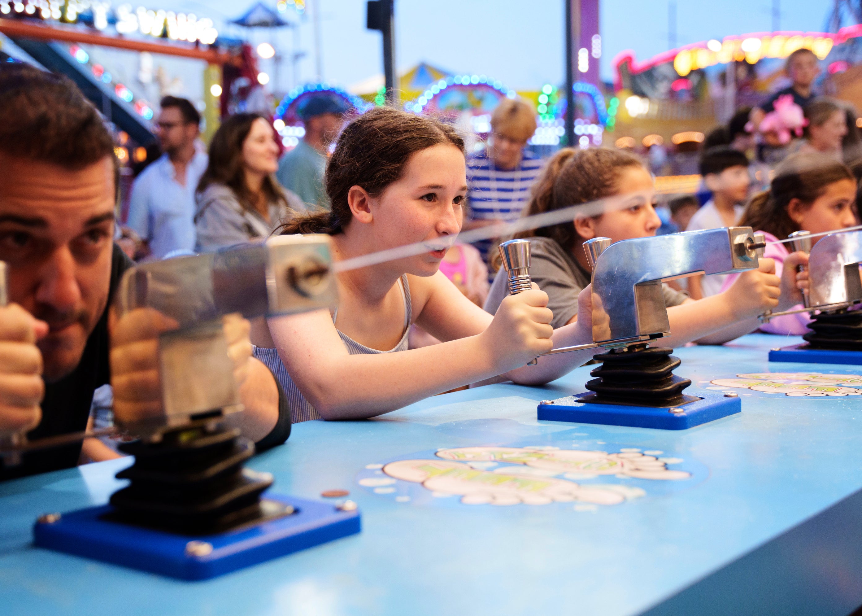 People play a water gun game at Playland's Castaway Cove amusement park, in Ocean City, N.J