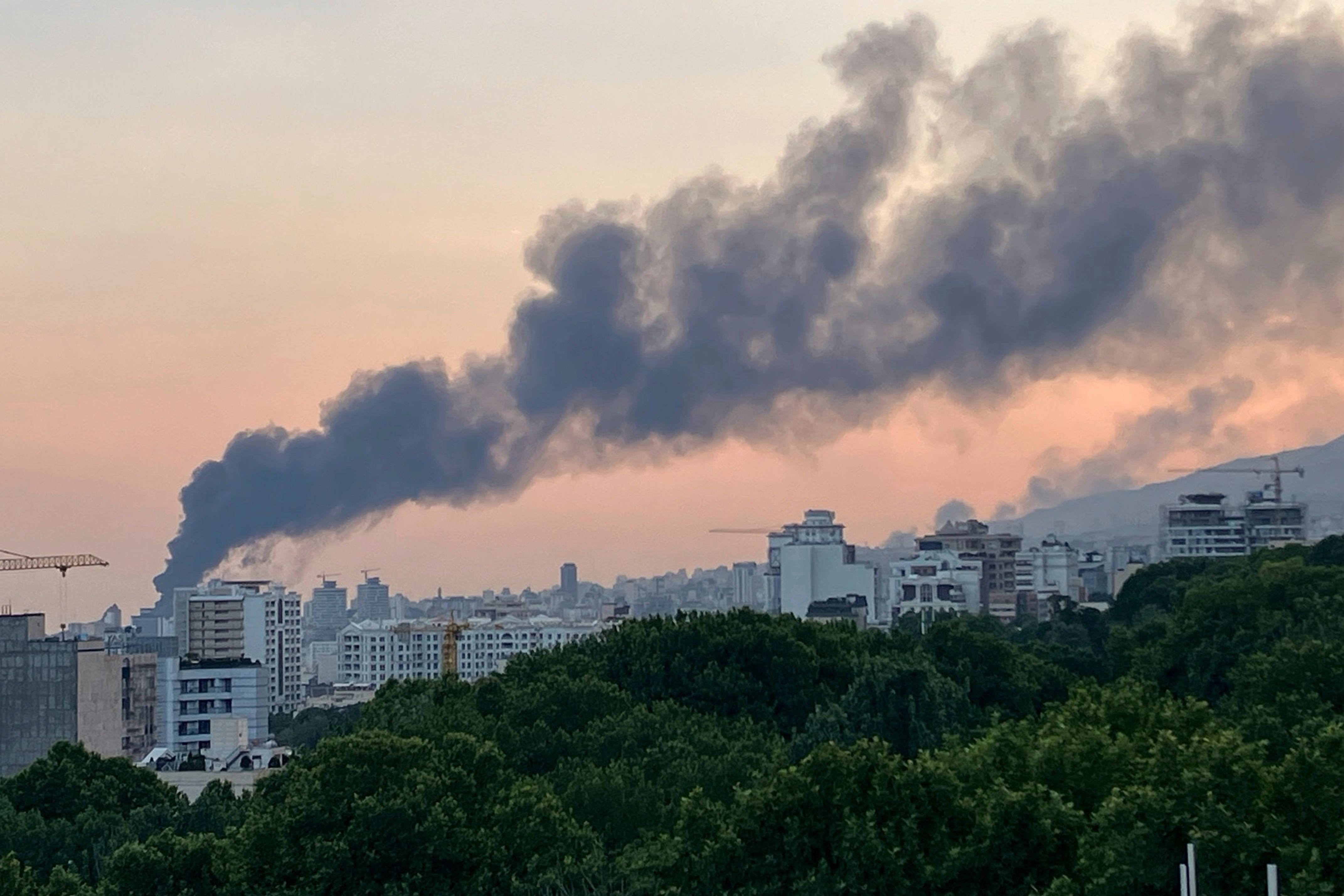 Smoke rises from the building of Iran’s state-run television after an Israeli strike in Tehran, Iran (AP)