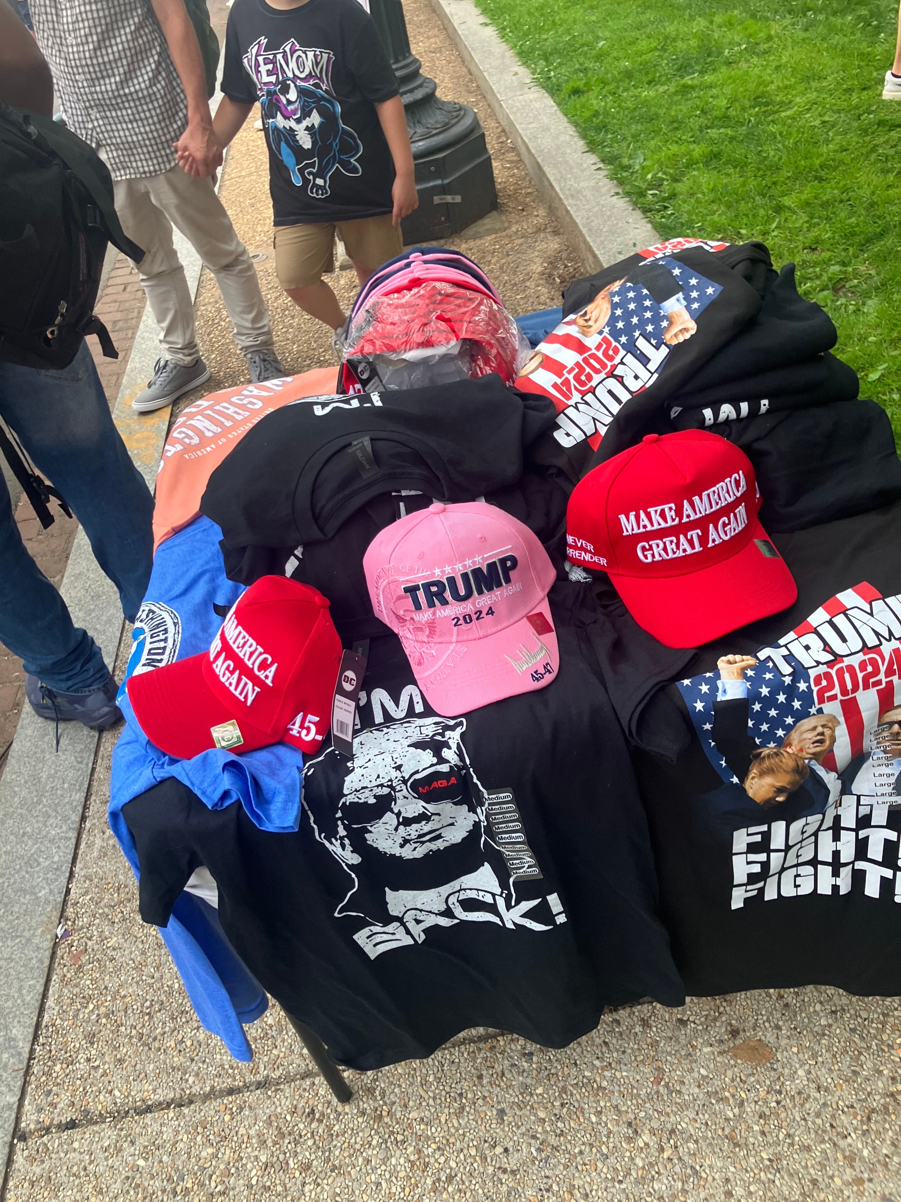 Plenty of street vendors hawked “Make America Great Again” hats and images of Trump saying “Daddy’s Home.”