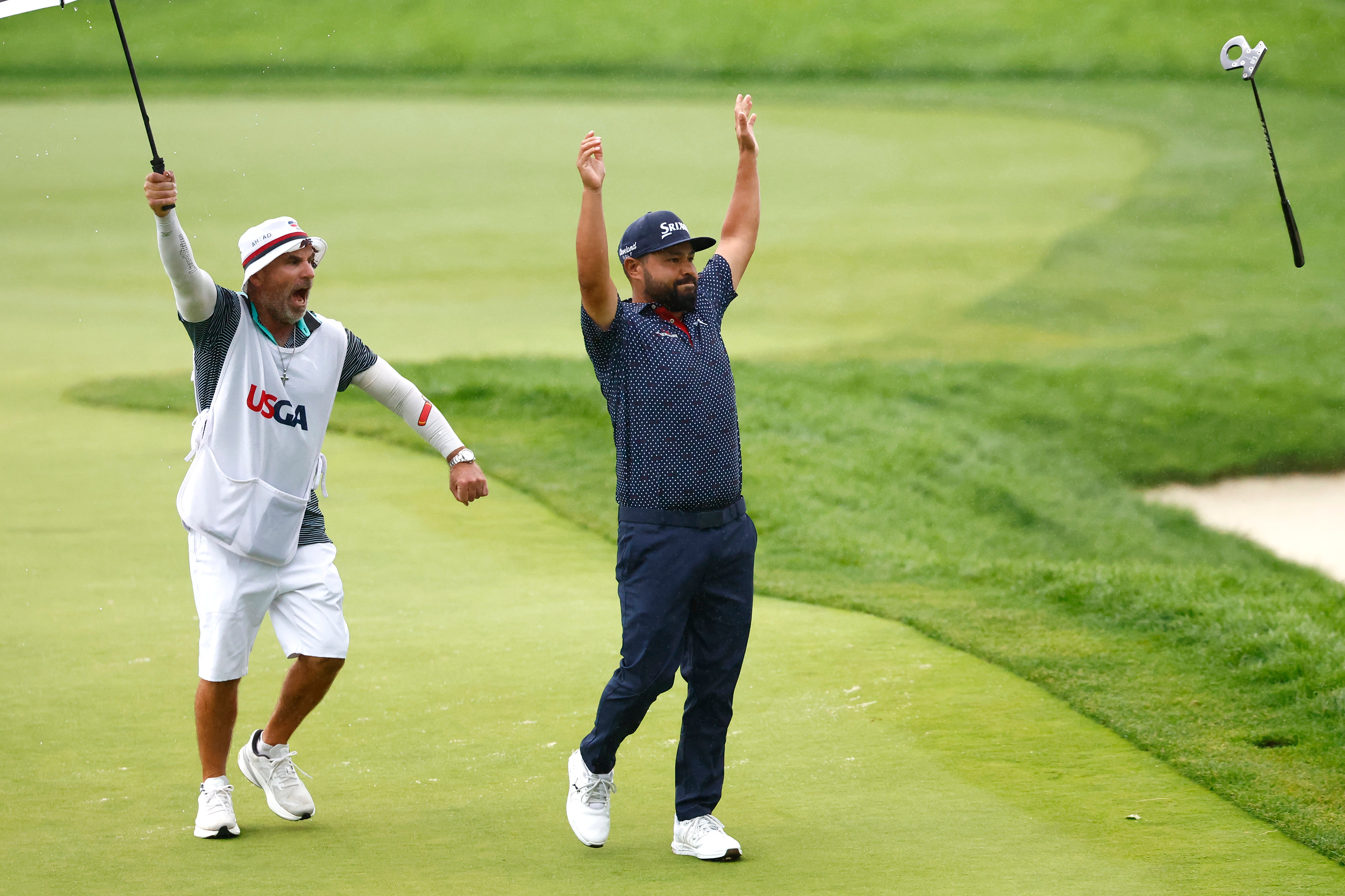 JJ Spaun celebrated victory on the 18th green with caddie Mark Carens