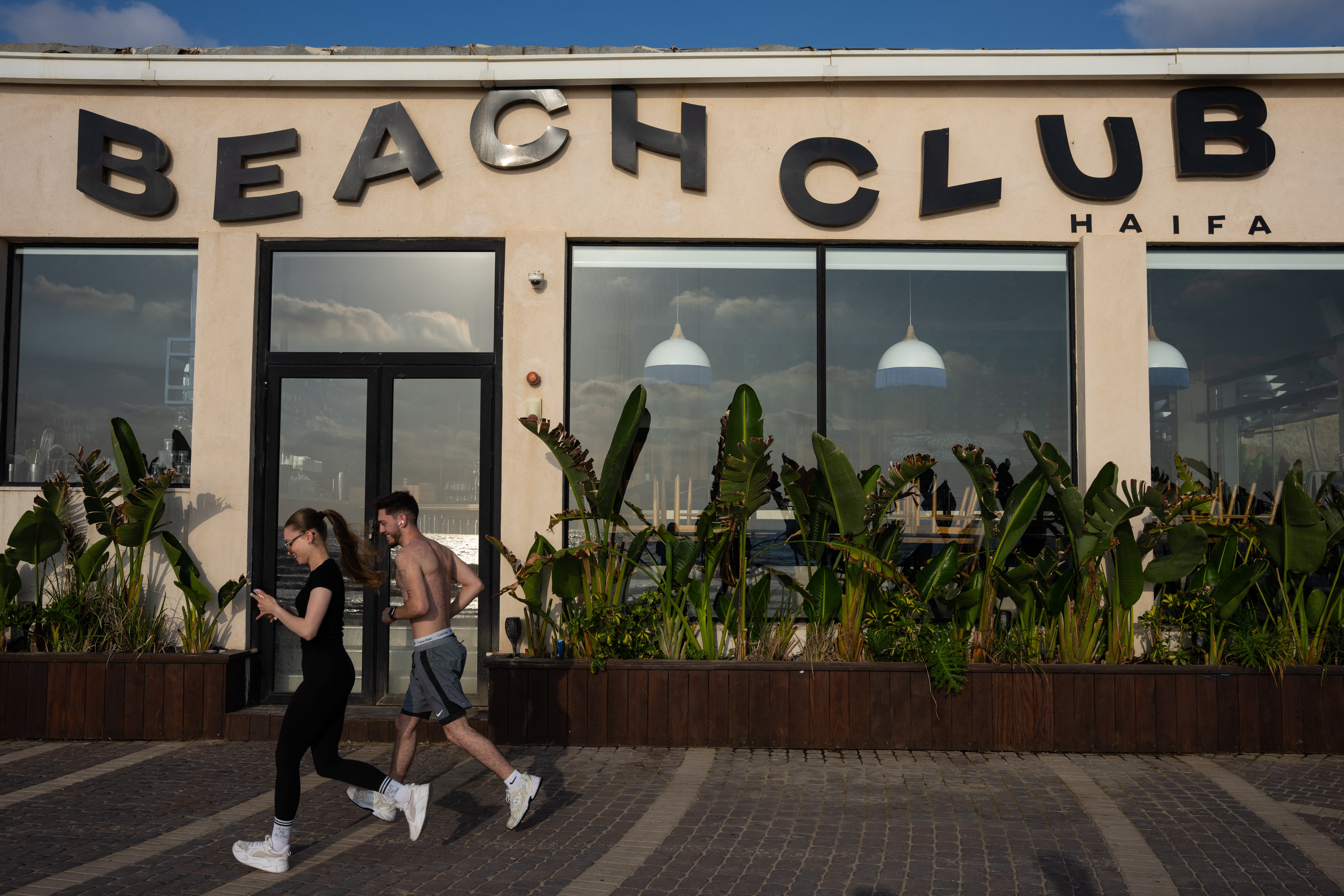 Israelis try to keep to a normal life despite the threat of attacks in Haifa