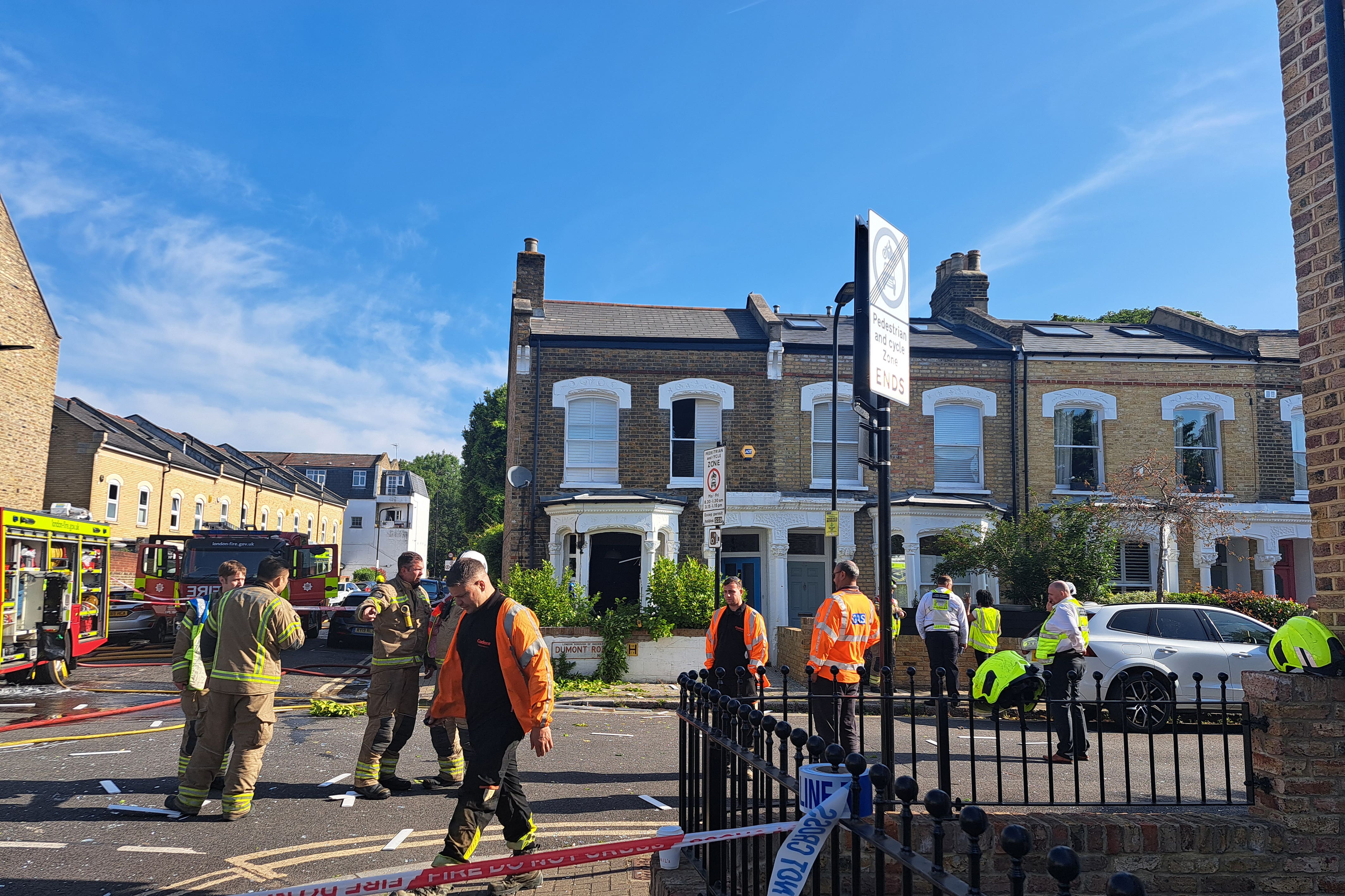 Emergency services near to the scene of a suspected gas explosion which tore through a terrace house in the early hours of the morning in Stoke Newington, north-east London (Lily Shanagher/PA)
