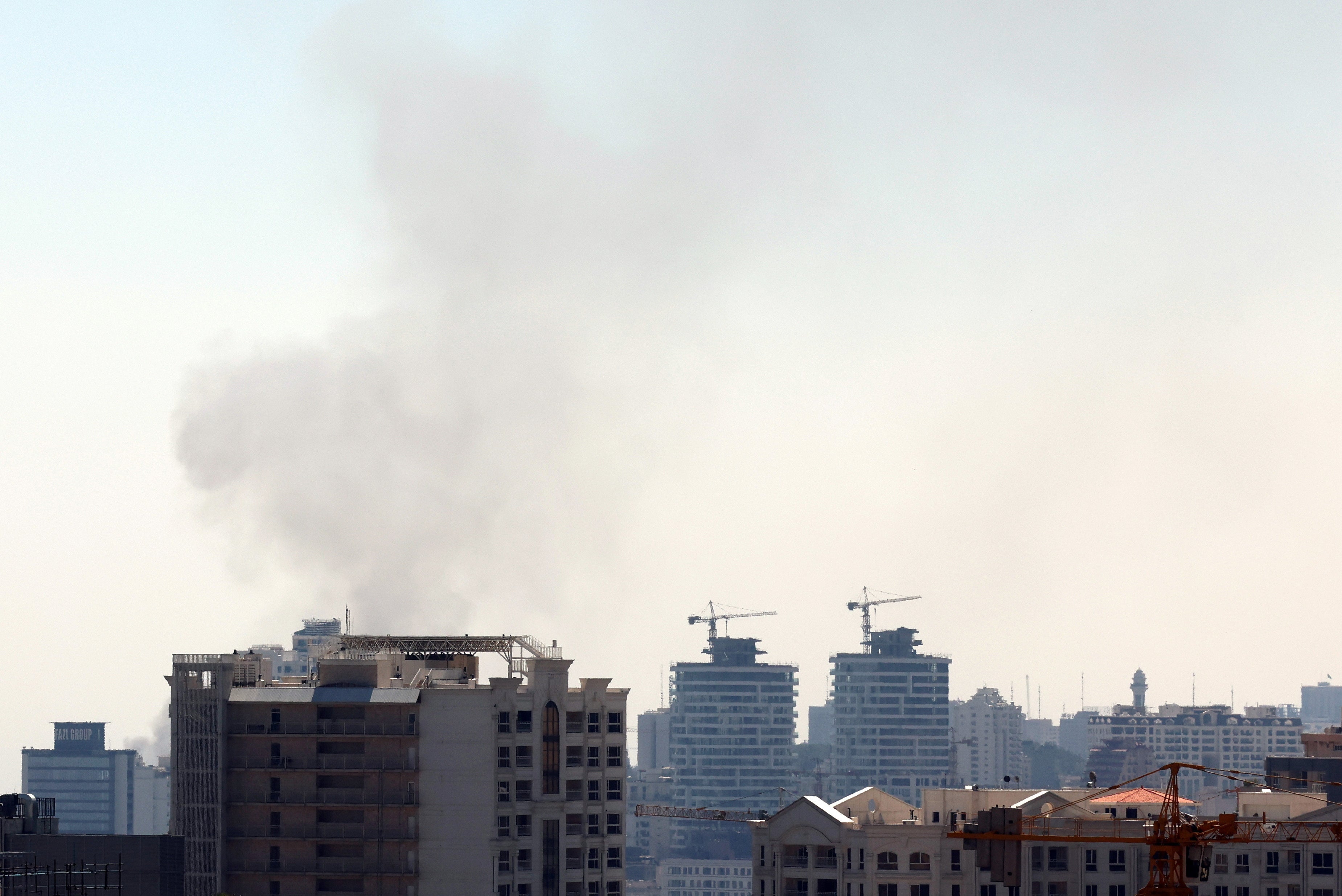 Smoke rises after an Israel airstrike in central Tehran