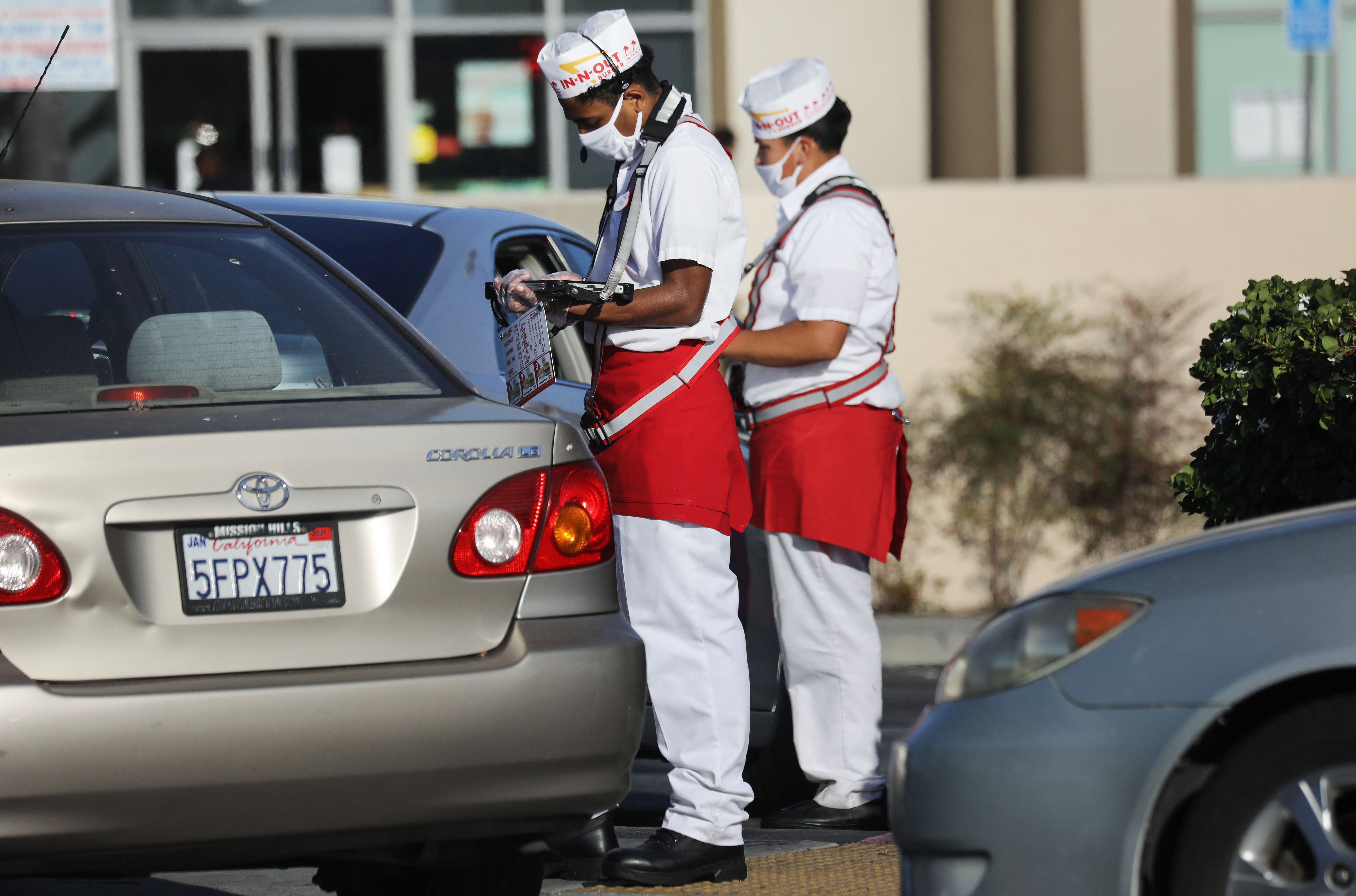 In-N-Out requires its employees to wear company-issued hats with their hair tucked in, and male employees must be clean-shaven
