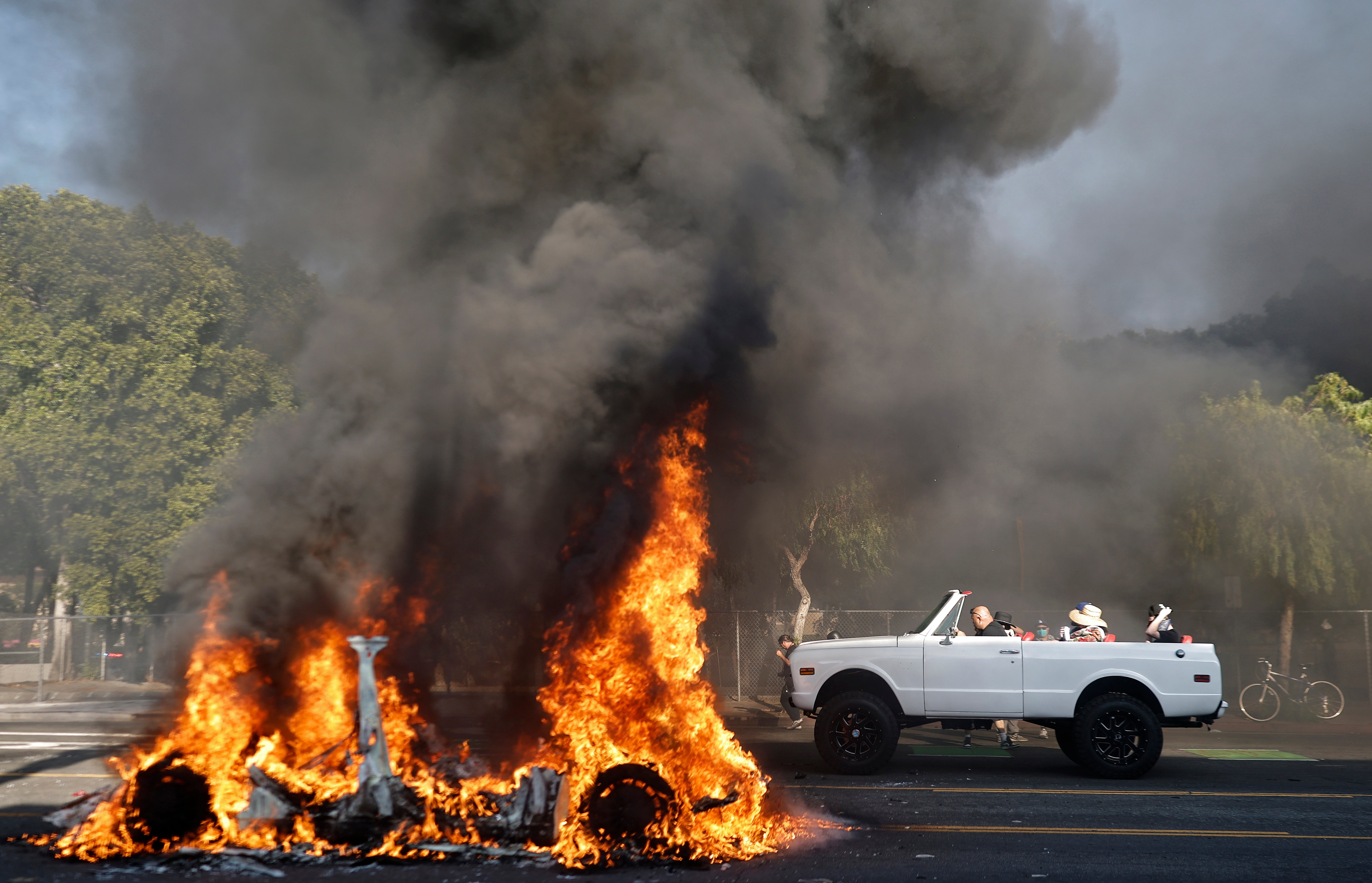 A Waymo car burns amid anti-ICE protests in Los Angeles earlier this month