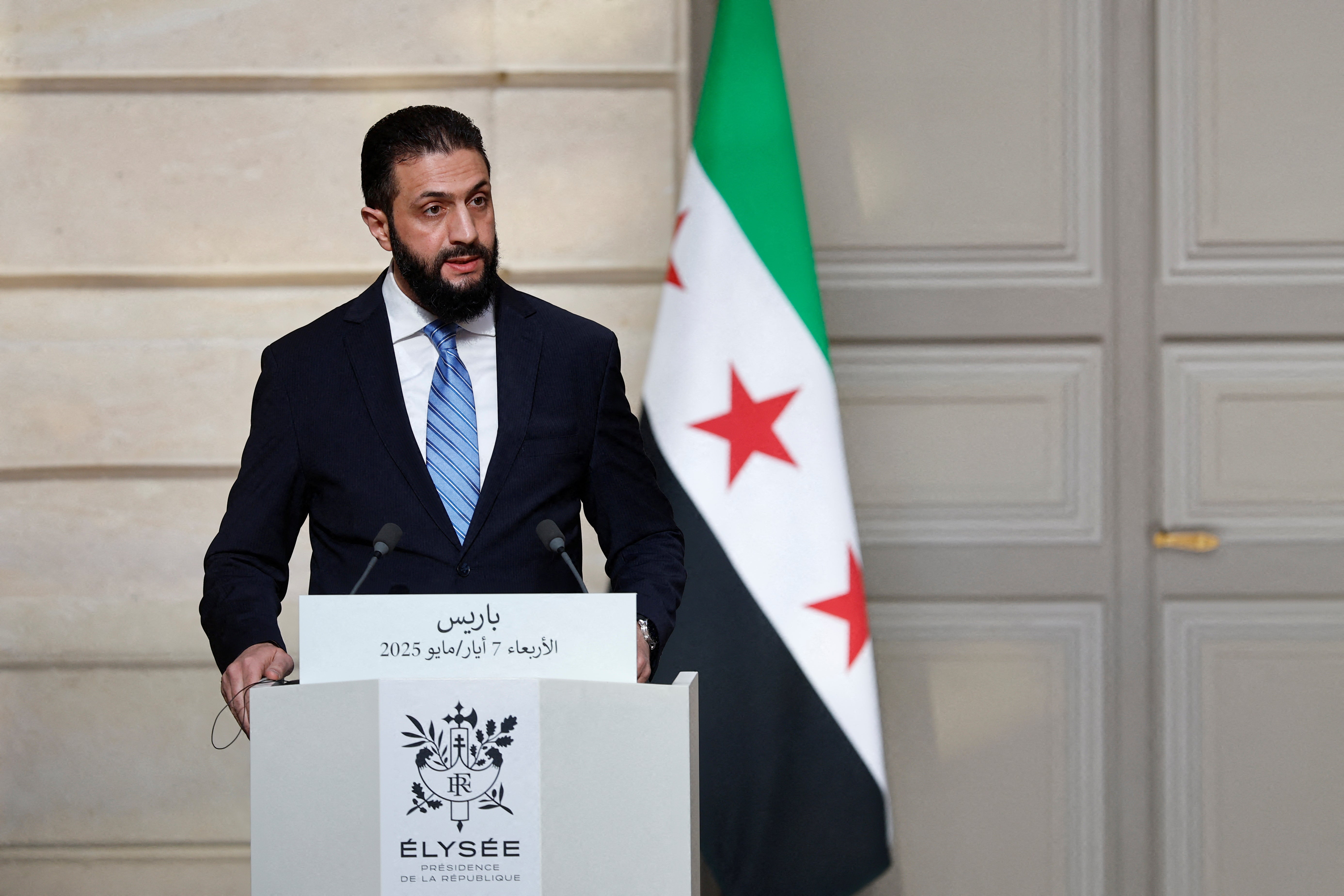 Ahmed al-Sharaa, interim president of Syria, speaks during a joint press conference after a meeting at the Elysee Palace in Paris in May