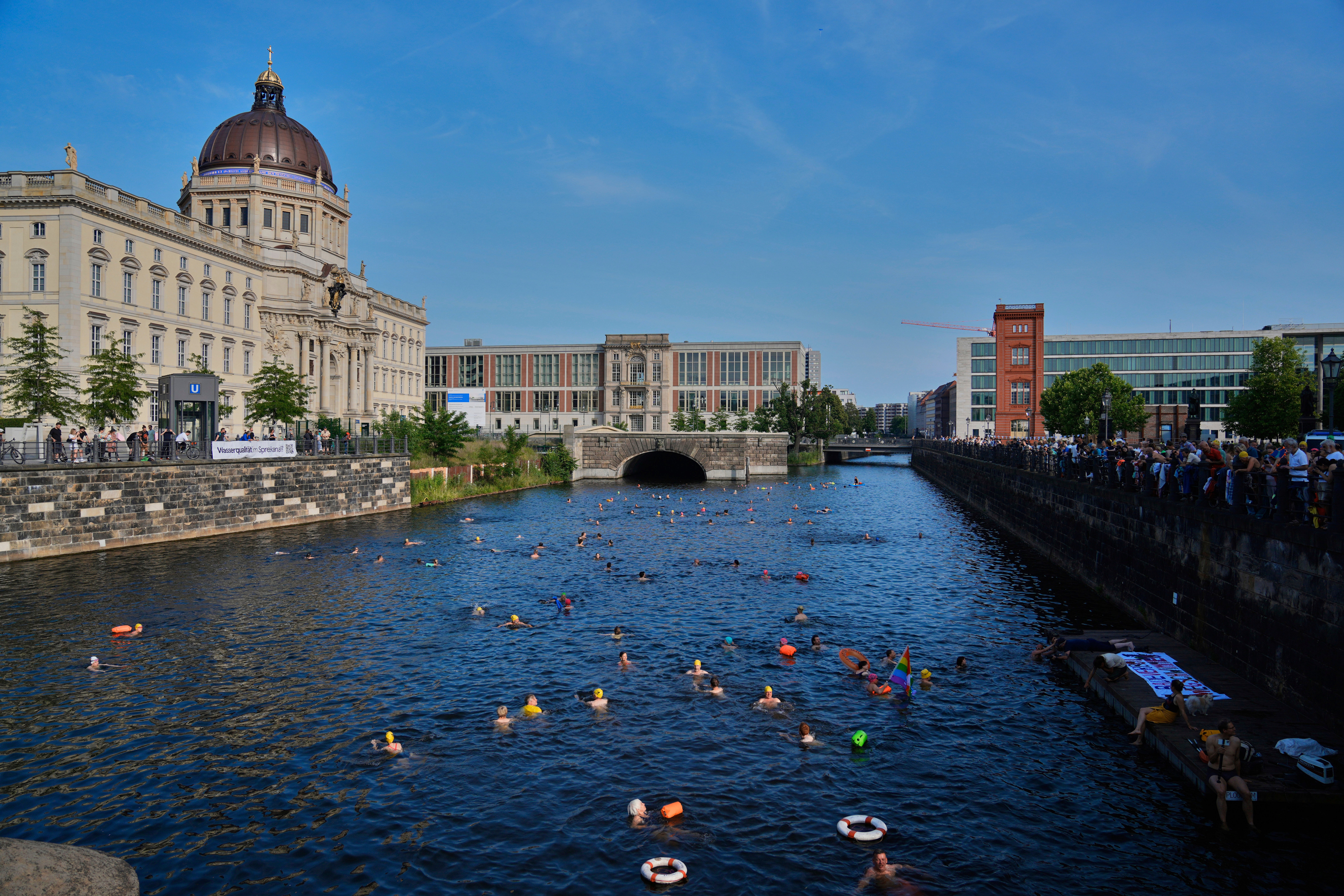 Germany Berlin River People swim in the river Spree to demand the lift of the hundred years old swimming ban at the river in front of the Stadtschloss or City Place in Berlin, Germany, Tuesday, June 17, 2025