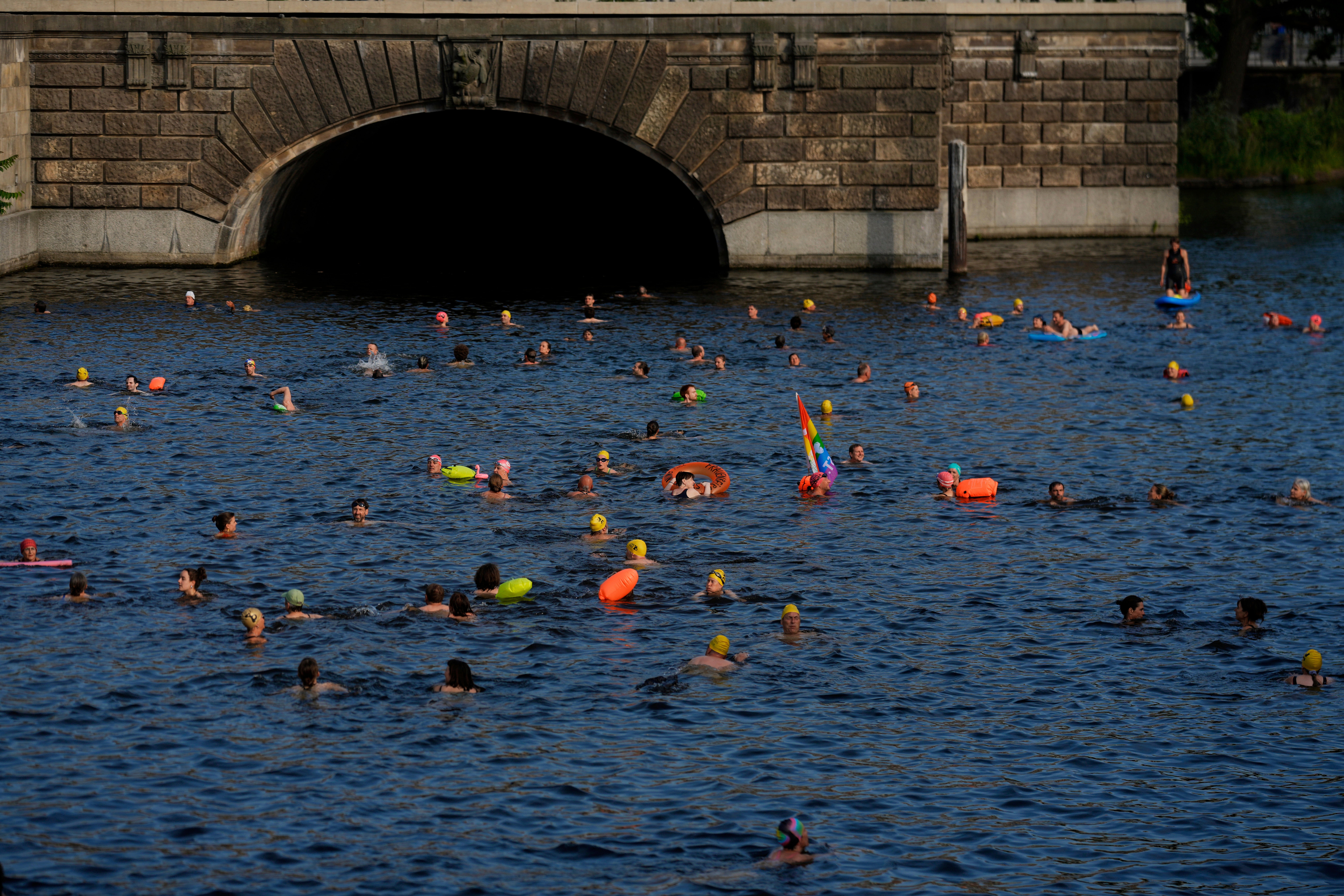 People swim in the river Spree to demand the lift of the hundred years old swimming ban at the river in Berlin, Germany, Tuesday, June 17, 2025