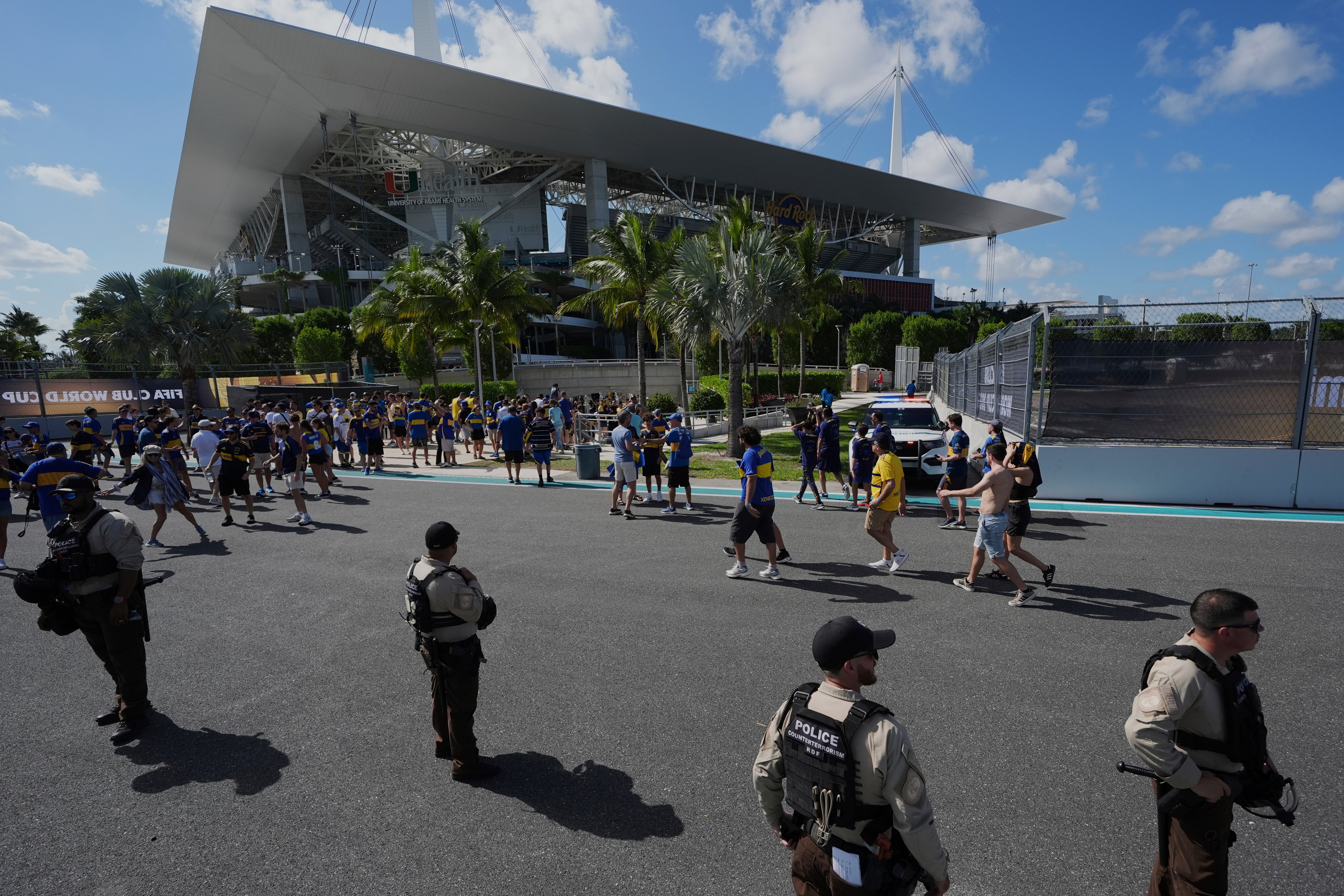Law enforcement personnel stand outside the stadium prior to the Club World Cup group C soccer match between Boca Juniors and Benfica in Miami Gardens