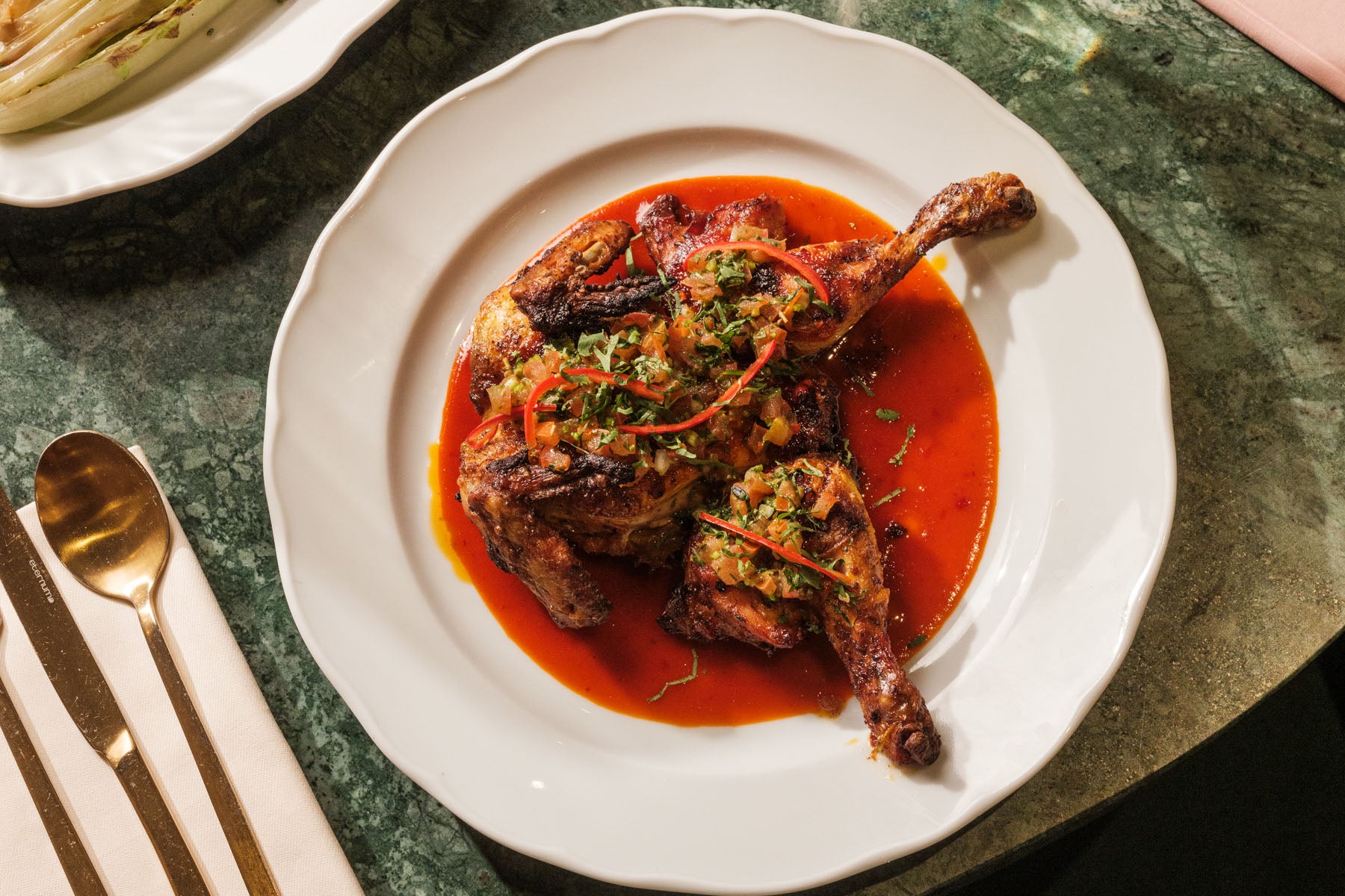 Charred spatchcock poussin with pickled chilli and fresh salsa – perfect for the barbecue