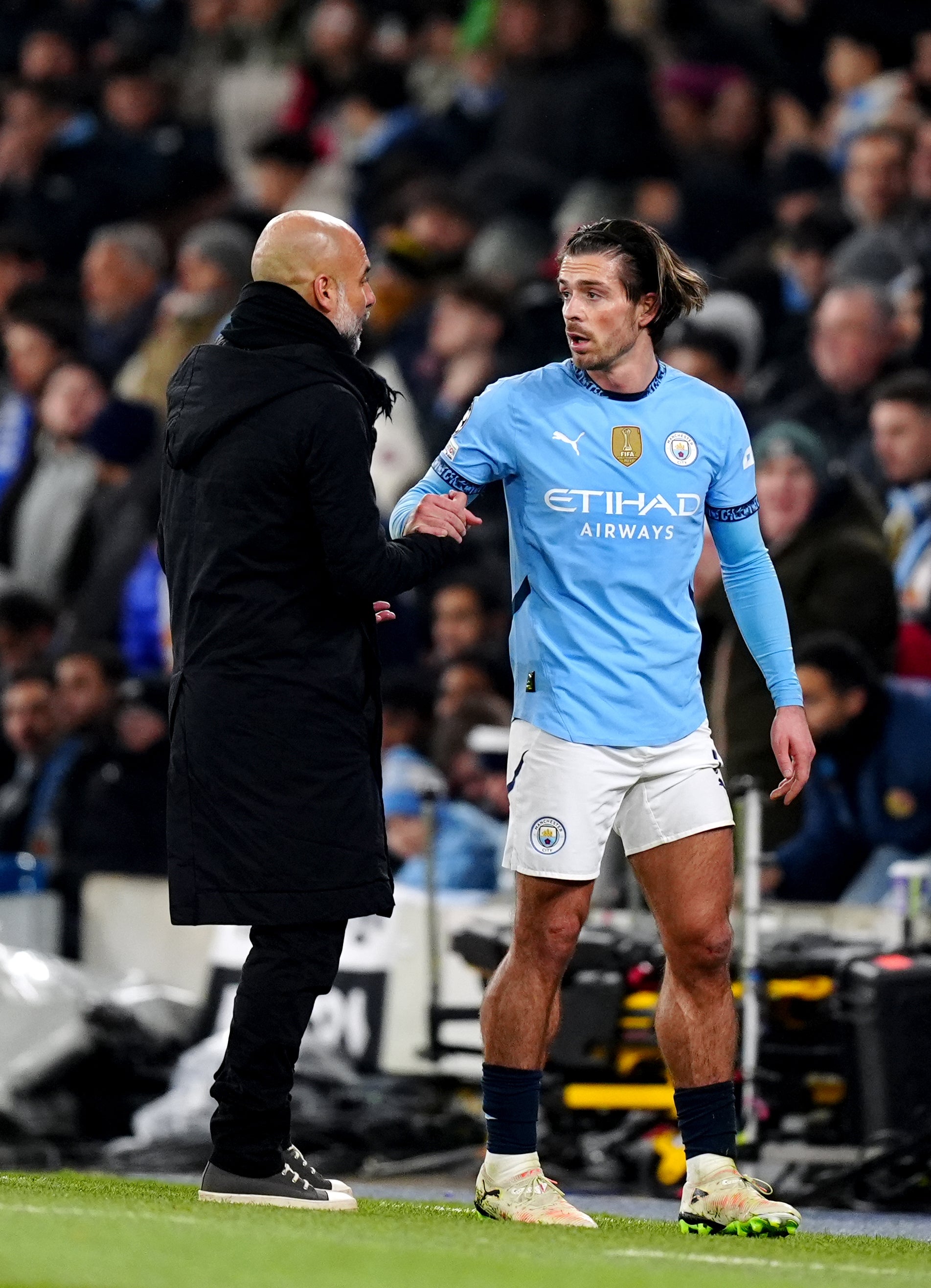 Guardiola (left) gave Grealish (right) just seven Premier League starts last season (Mike Egerton/PA)