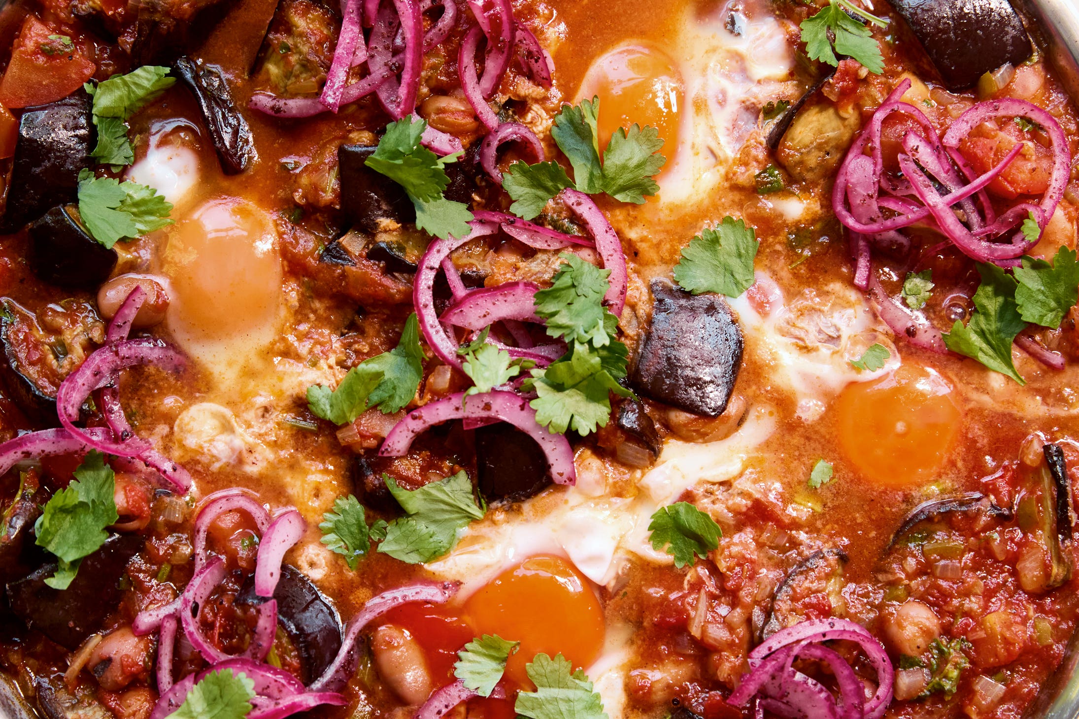 Soft aubergine, spiced fava beans and runny eggs – proof that the best brunches need just one pan and plenty of bread to mop it all up