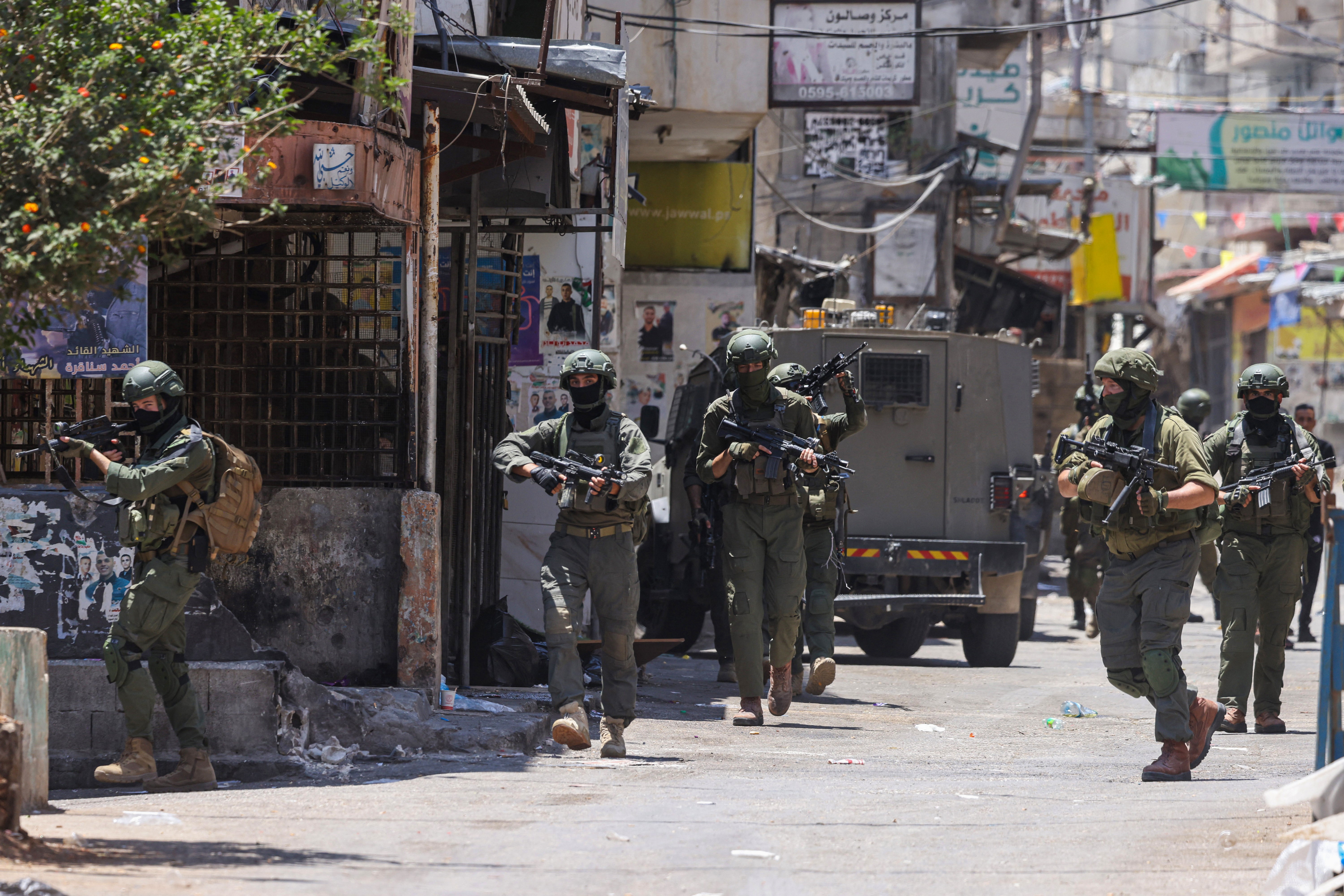 Israeli soldiers conduct a raid at the Balata refugee camp east of Nablus city in the occupied West Bank on 18 June