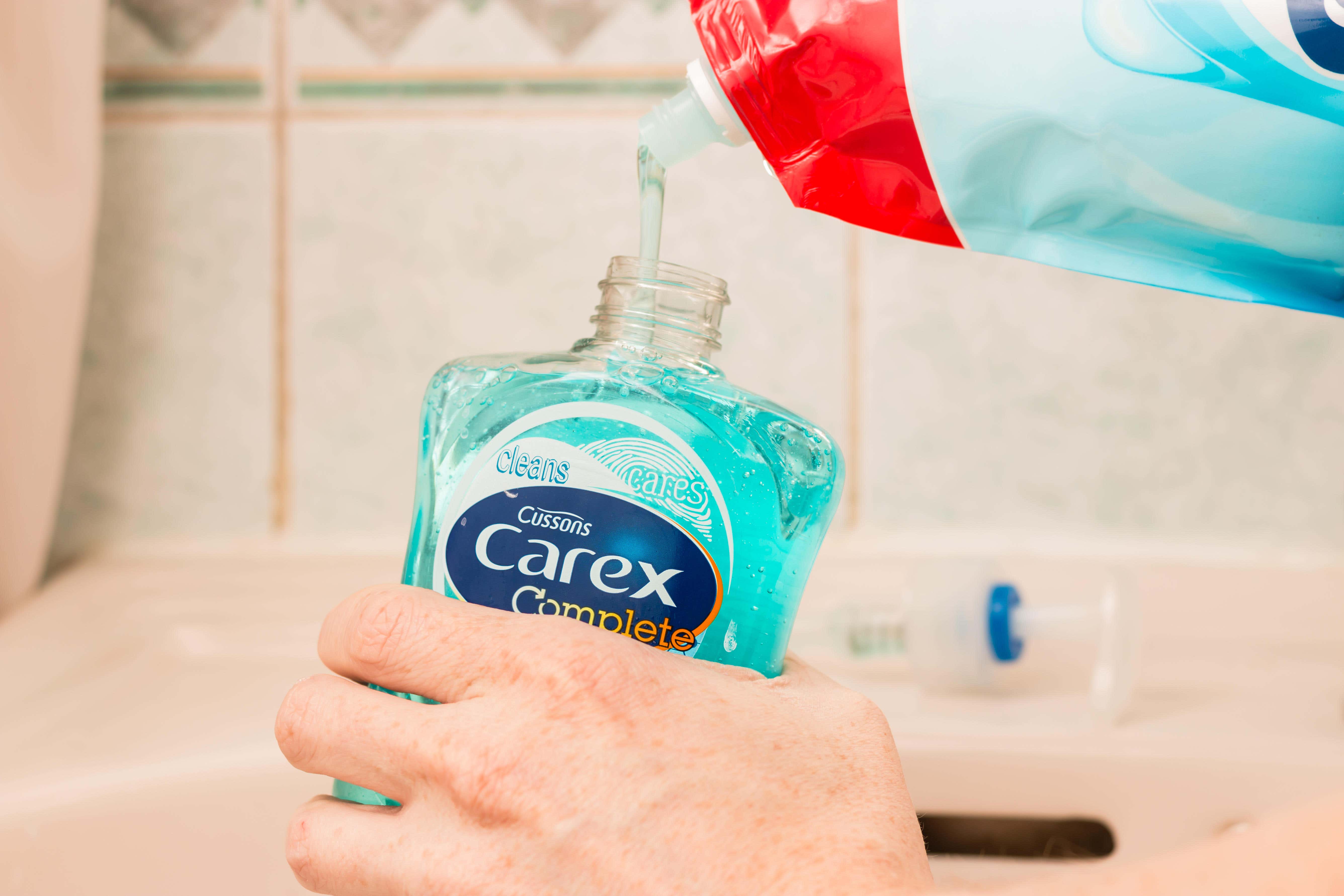 Imperial Leather and Carex soap firm PZ Cussons has trimmed the top end of its profit guidance and announced plans to sell its half of a Nigerian oils business (Alamy/PA)