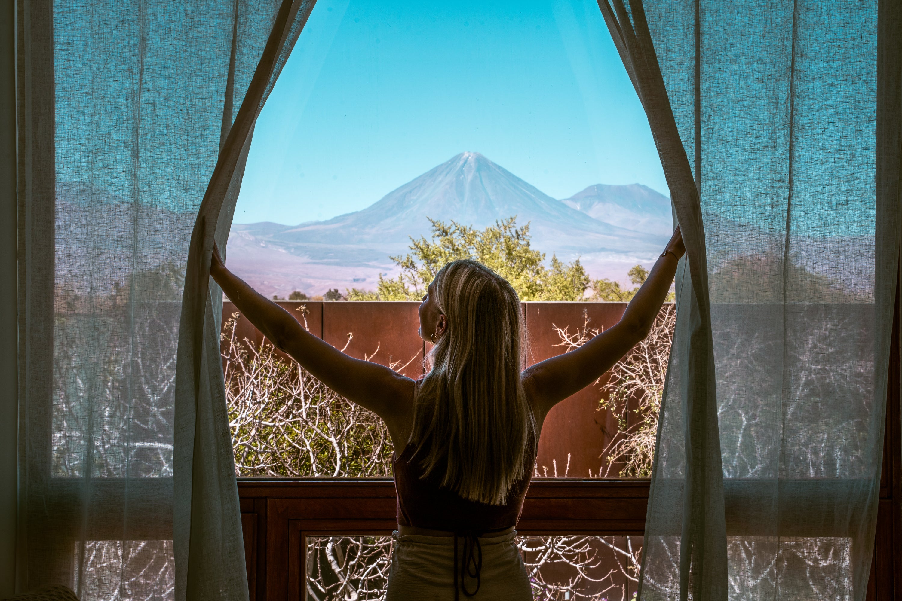 <p>The Licancabur volcano seen through a room at Tierra Atacama hotel.</p>