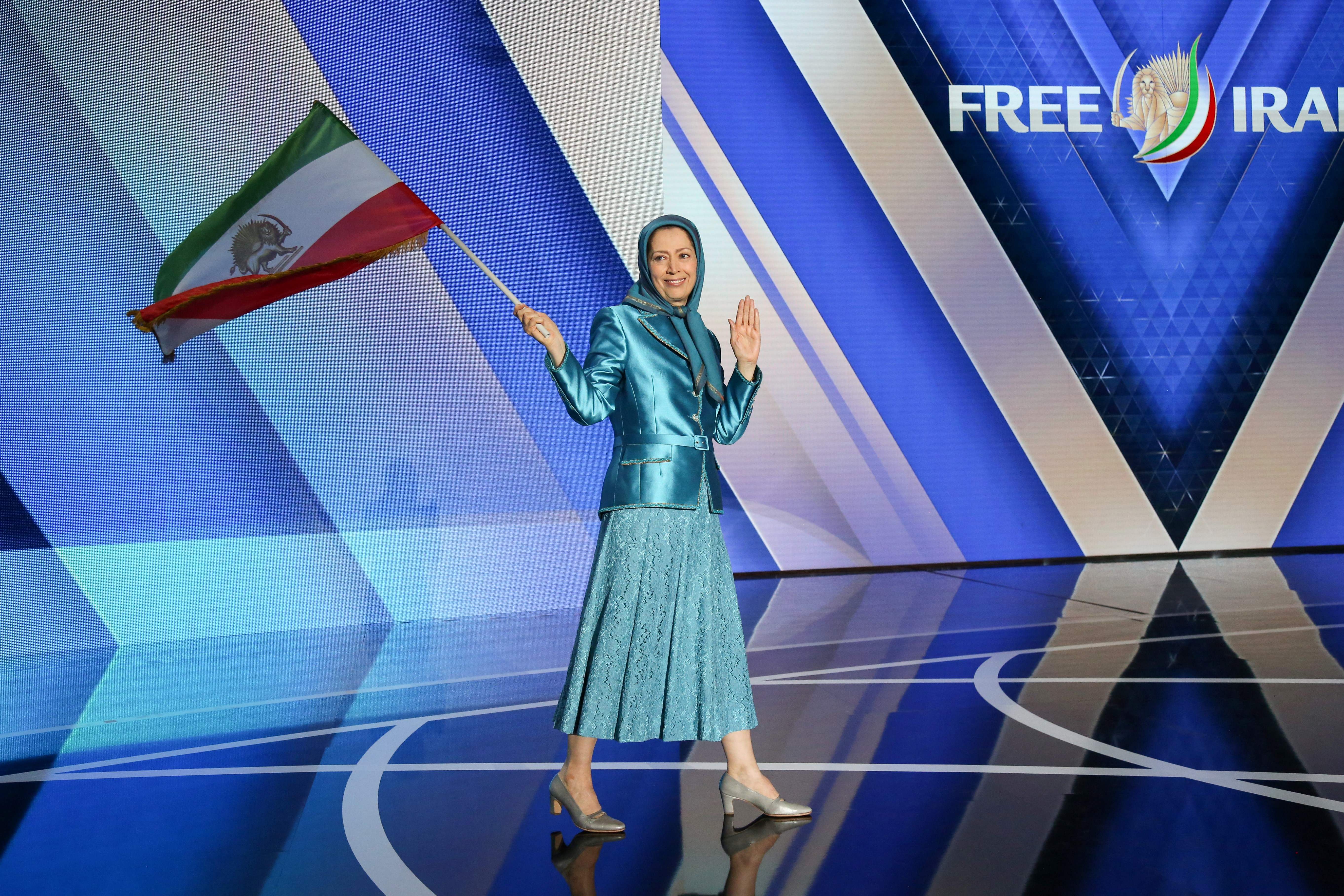 Maryam Rajavi, leader of the People’s Mujahideen, salutes her supporters as she arrives for a meeting organised by the group