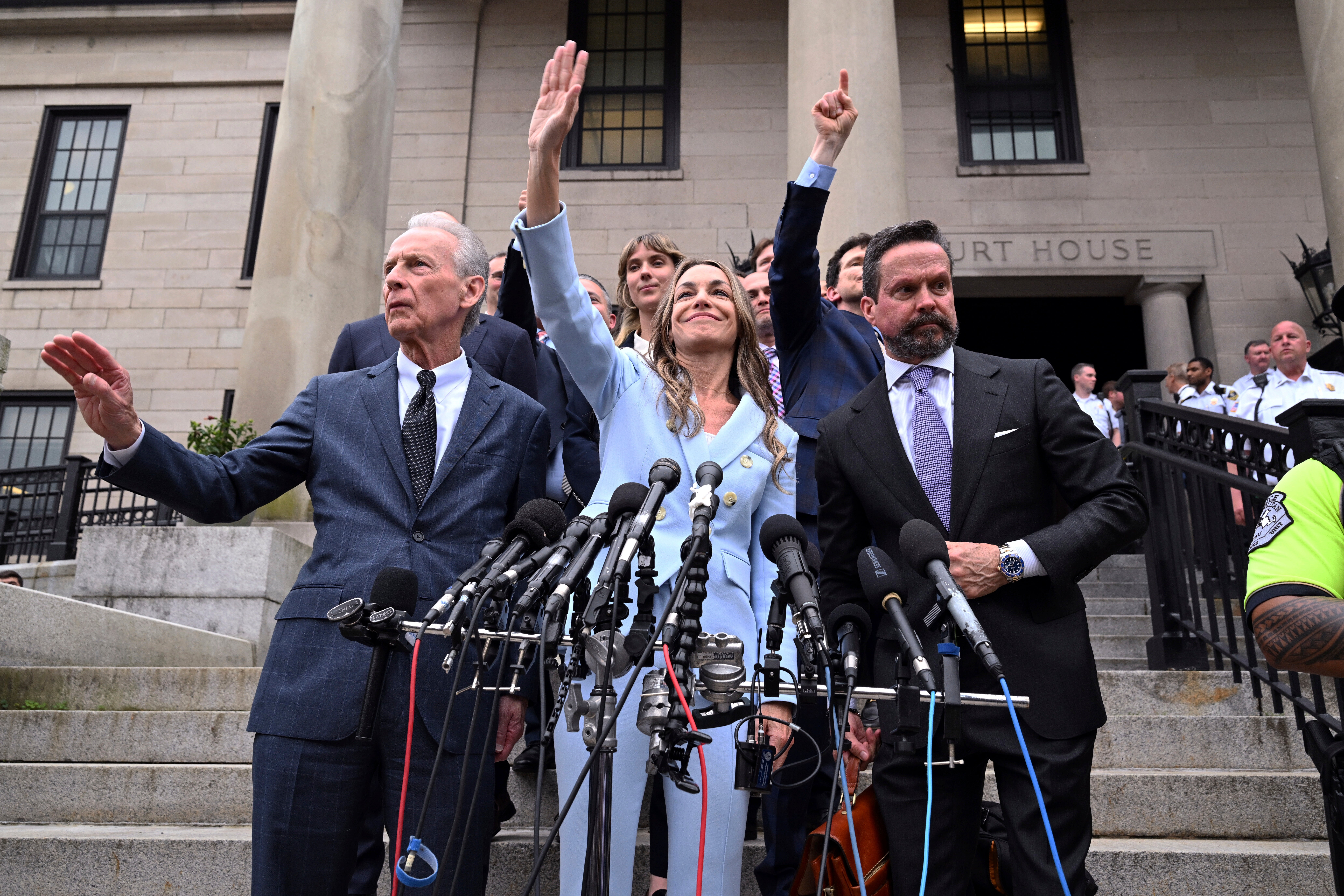 Karen Read, Center, waves for supporters after being found is not the murder of the second degree on Wednesday
