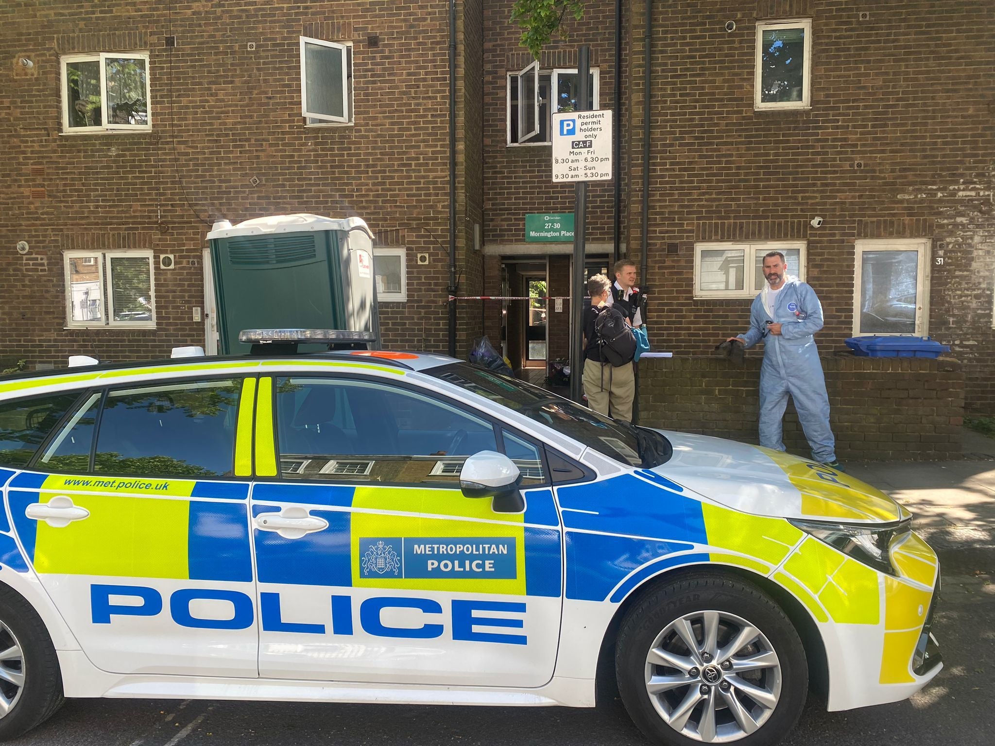 Police at the scene at Mornington Place, where Jennifer Abbott was found stabbed to death in her home