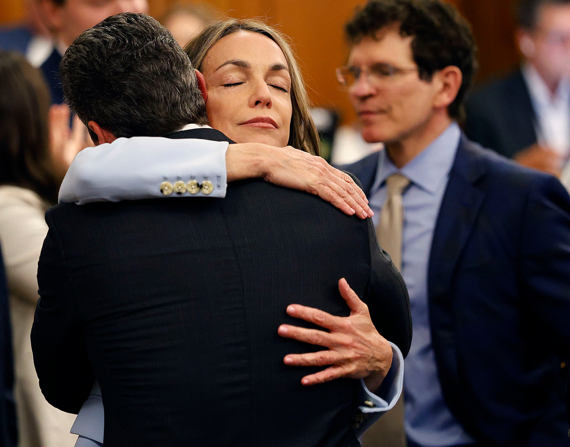 Karen Read hugs lawyer Alan Jackson after a not guilty verdict of second-degree murder is read in Norfolk Superior Court on Wednesday