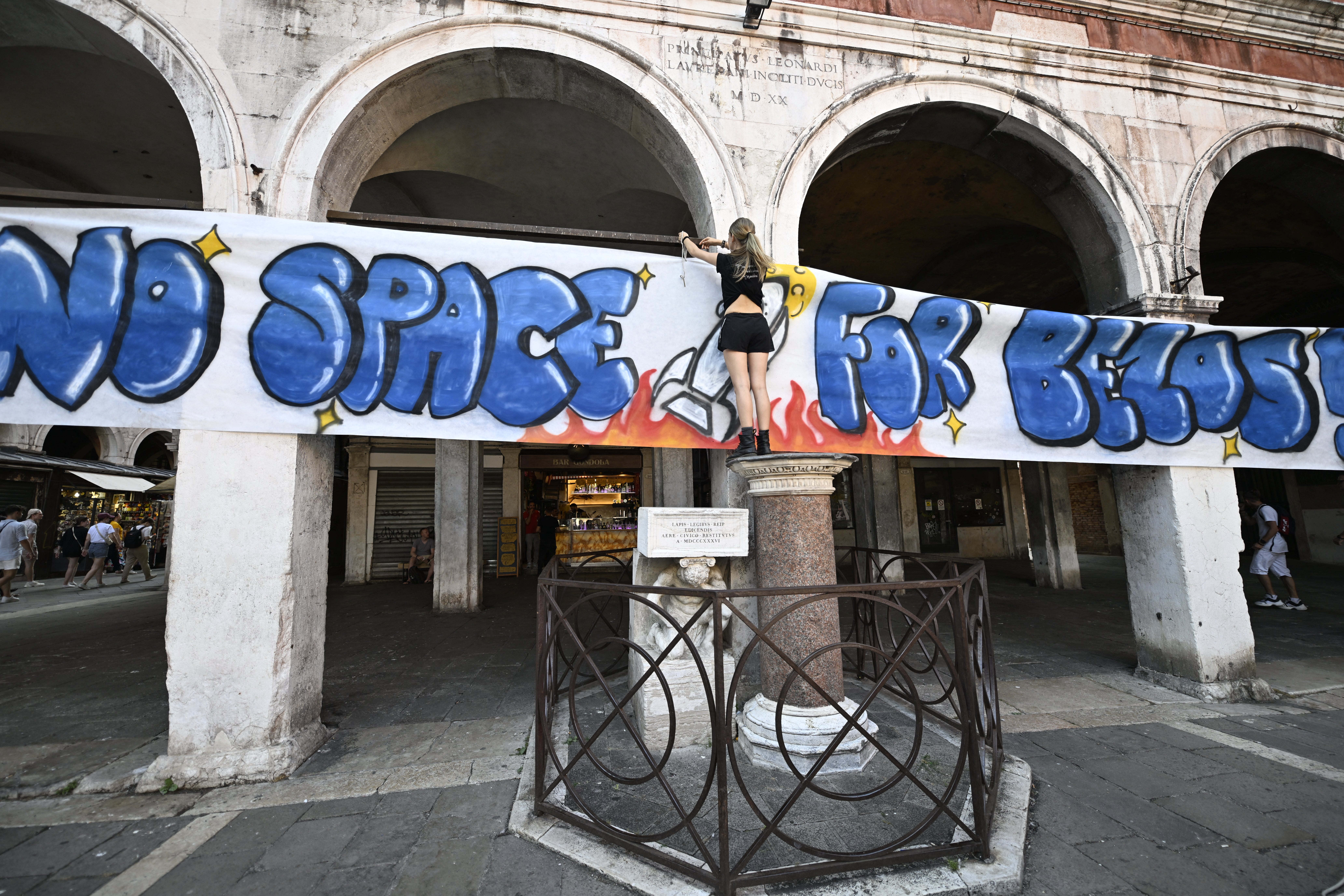 People gather to protest against the wedding of Amazon Founder and CEO Jeff Bezos and journalist Lauren Sanchez in Venice, on June 13, 2025
