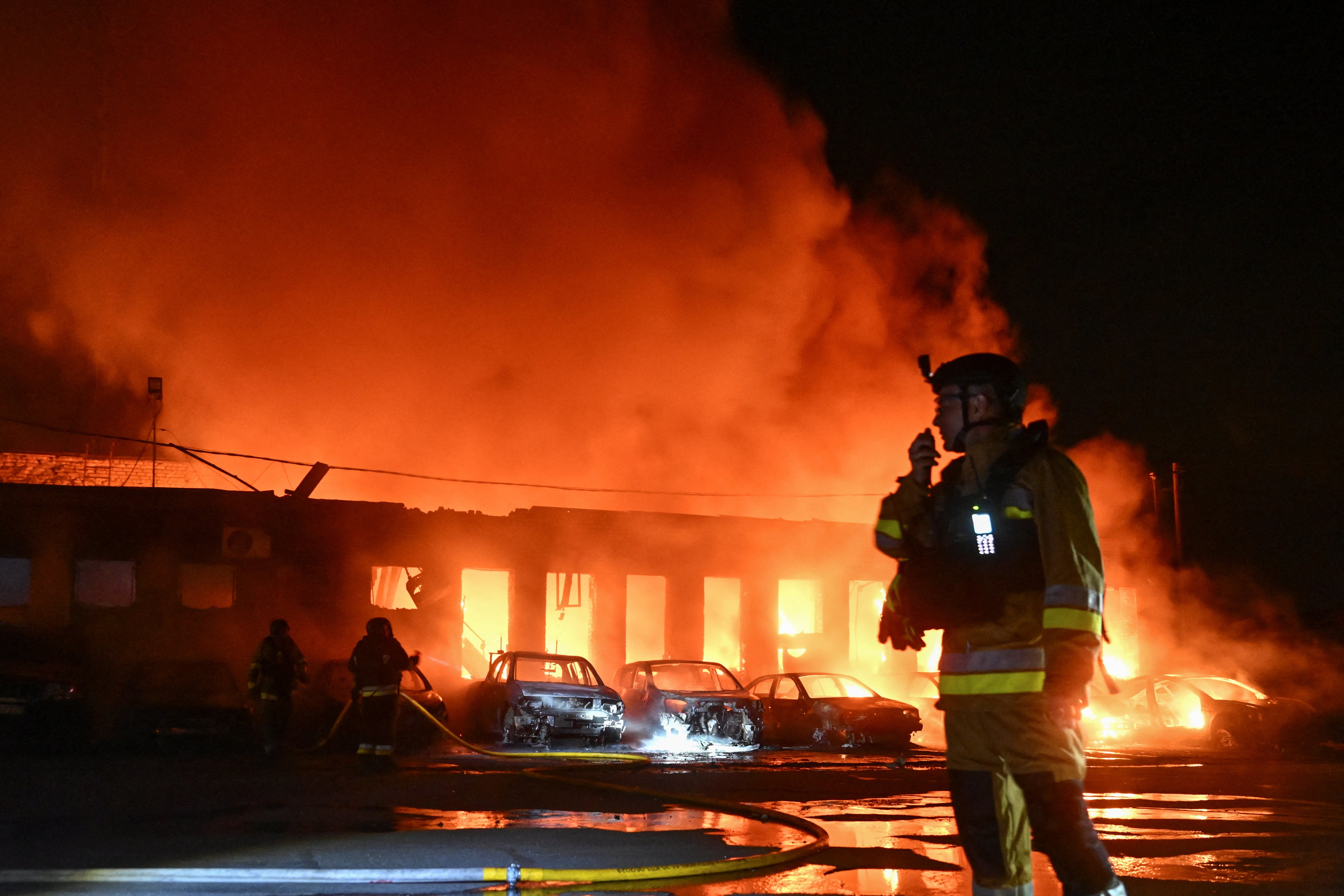 Firefighters in Zaporizhzhia put out a blaze caused by Russian strikes in June