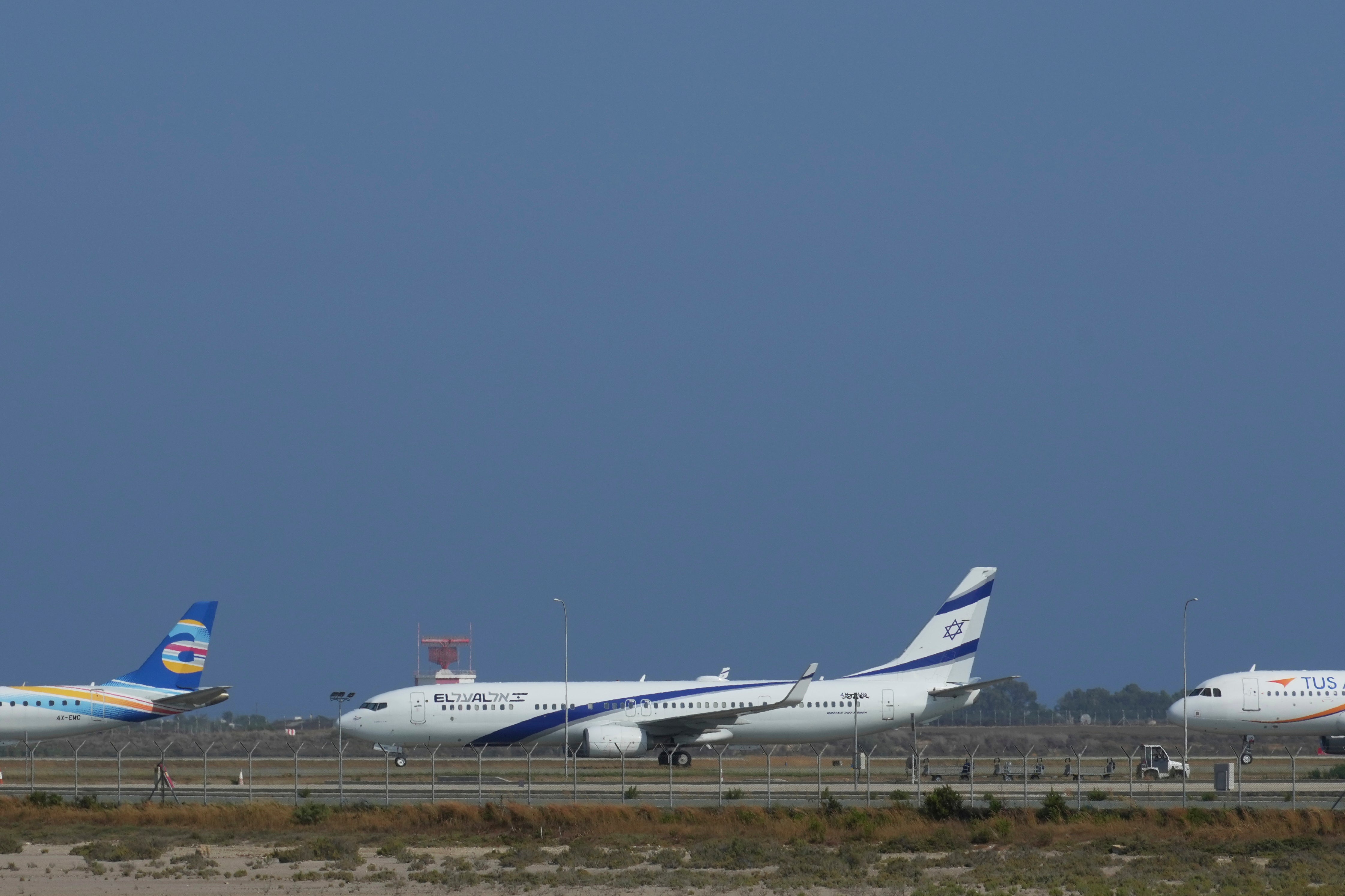 An aircraft belonging to Israeli airlines El Al sit parked in the tarmac of Cyprus' main airport in Larnaca