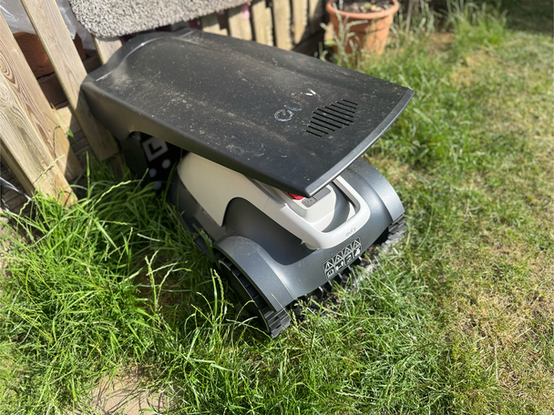 It has a nifty little self-charging garage, but it'll get wild if you place it on grass (Alex Lee)