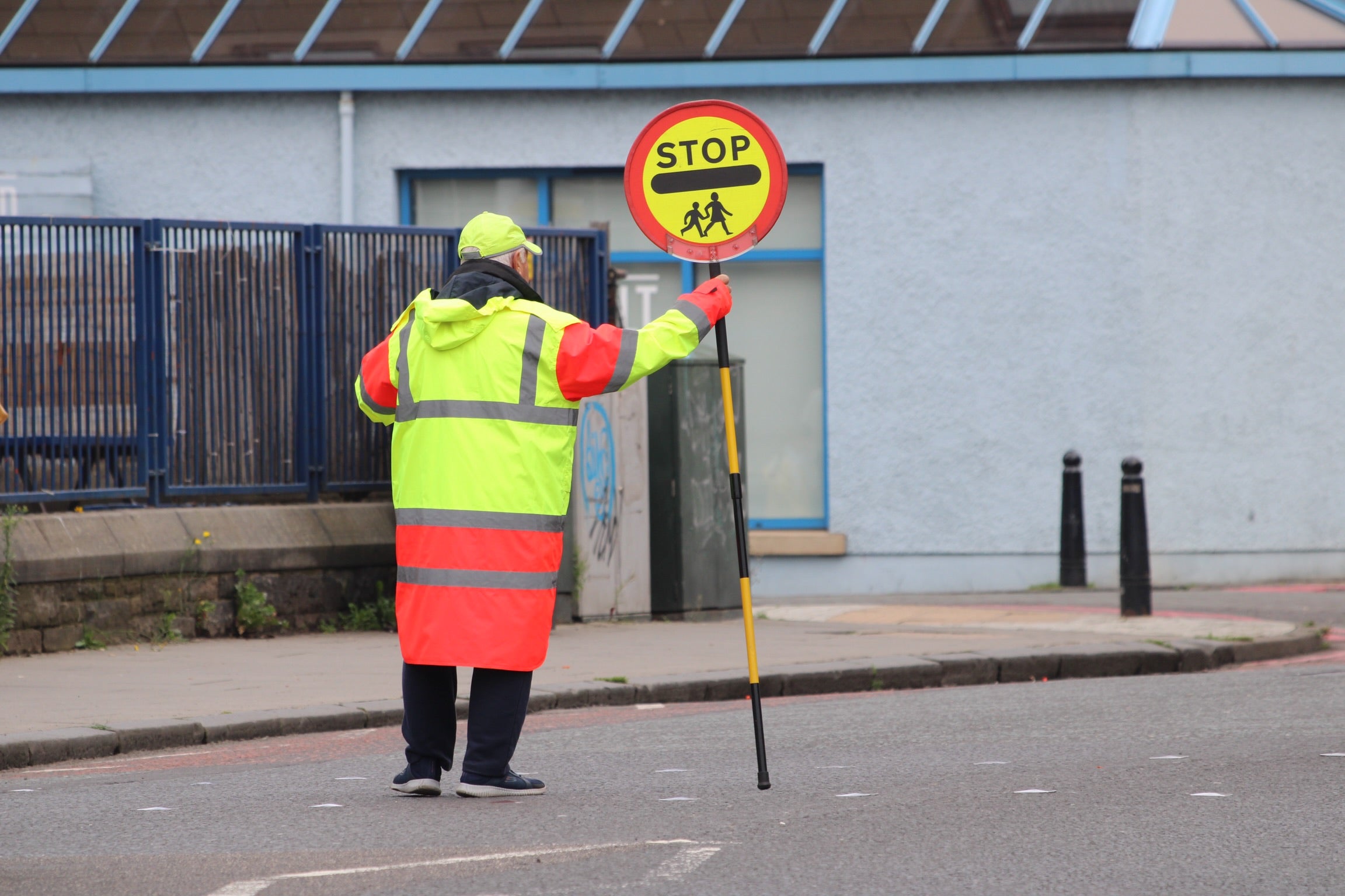 East Riding of Yorkshire Council said they had asked the lollipop man not to distract children as they crossed the road