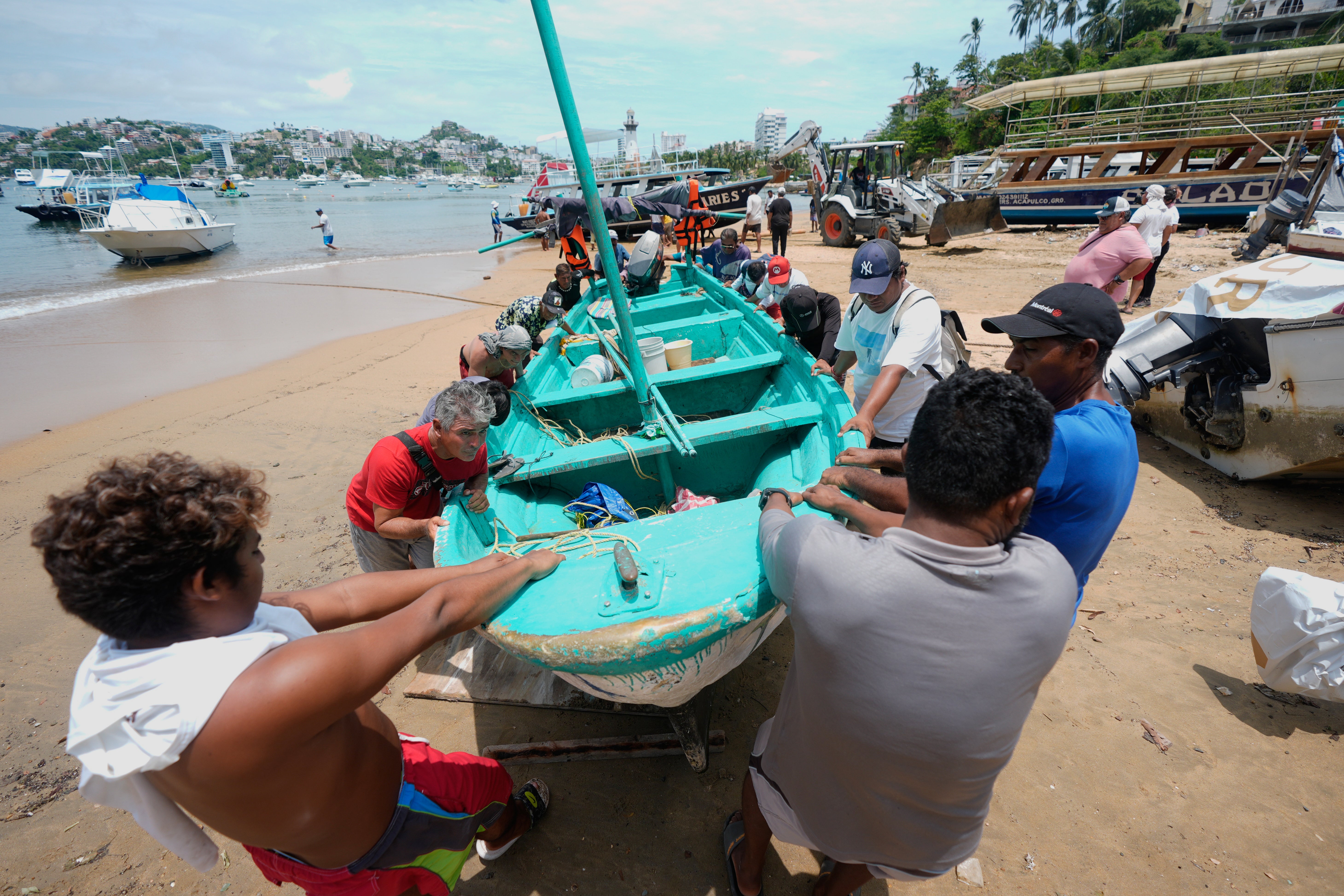 Boats are removed from the water to Manzanillo beach