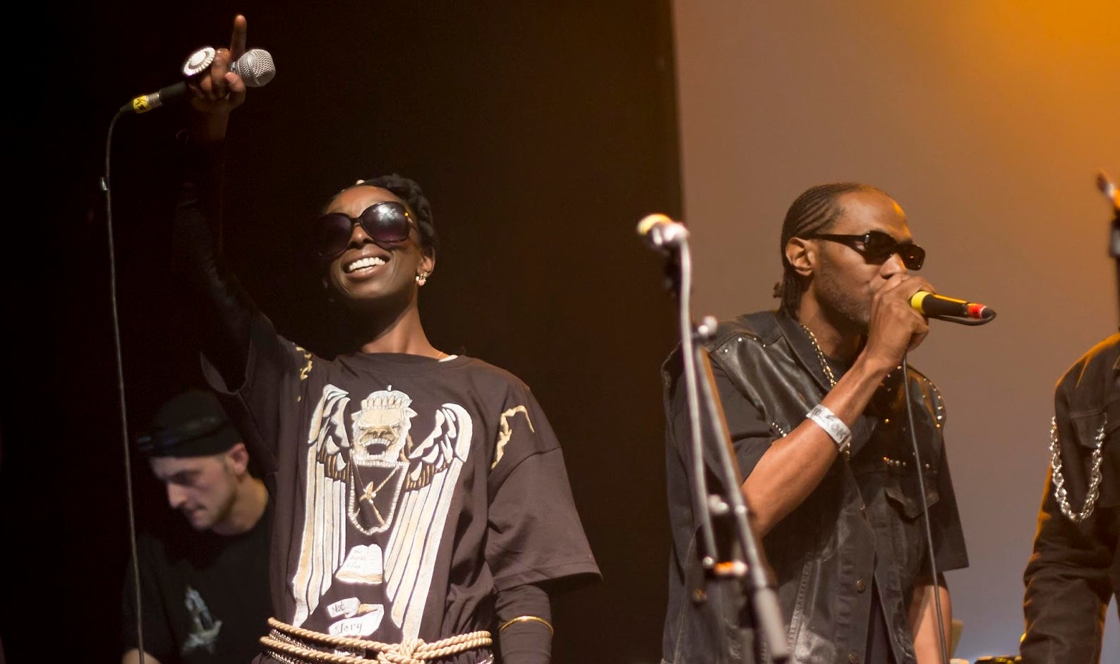 Olumide rapping on stage with Roots Manuva (Ricky Reason/PA)