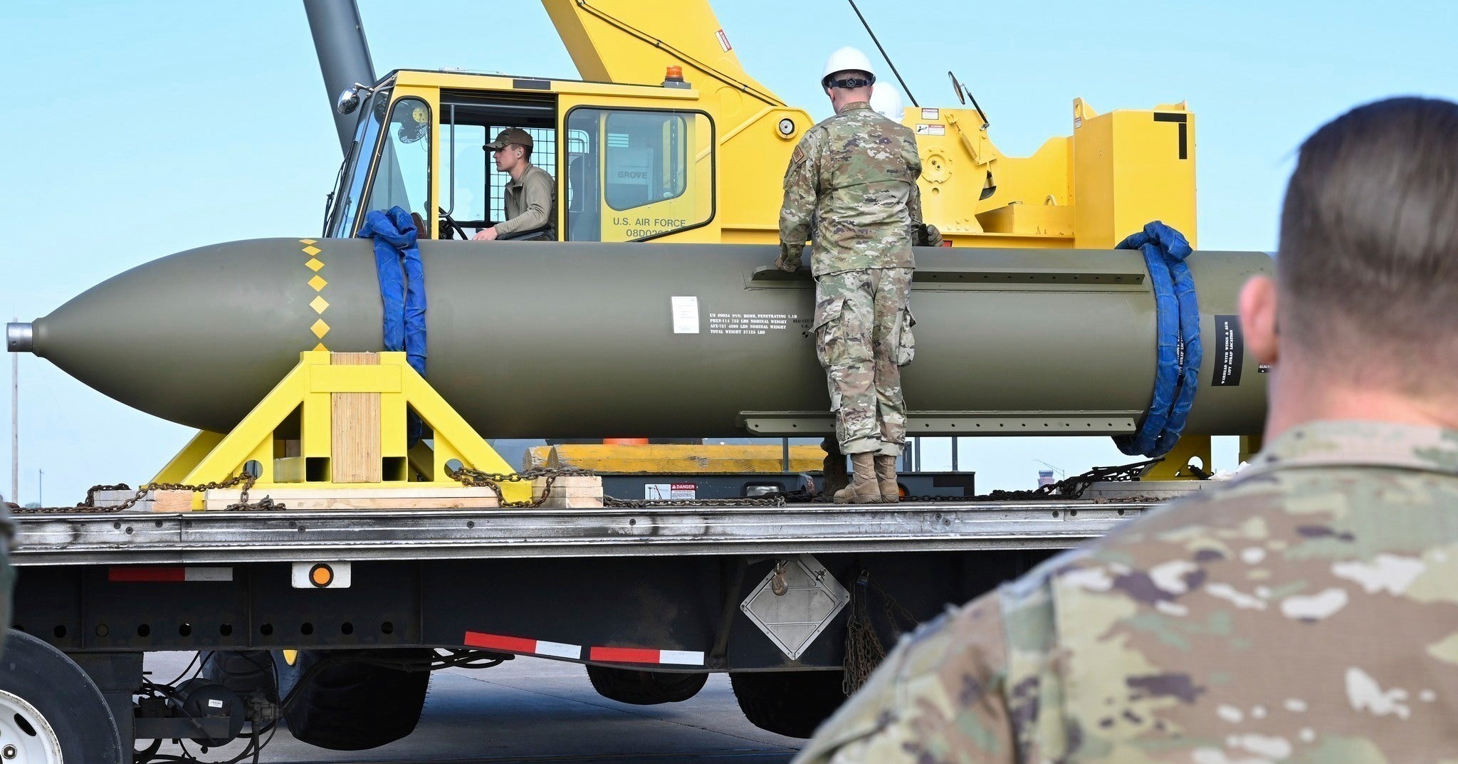In this photo released by the US Air Force in 2023, airmen look at a GBU-57 Massive Ordnance Penetrator bomb at Whiteman Airbase in Missouri
