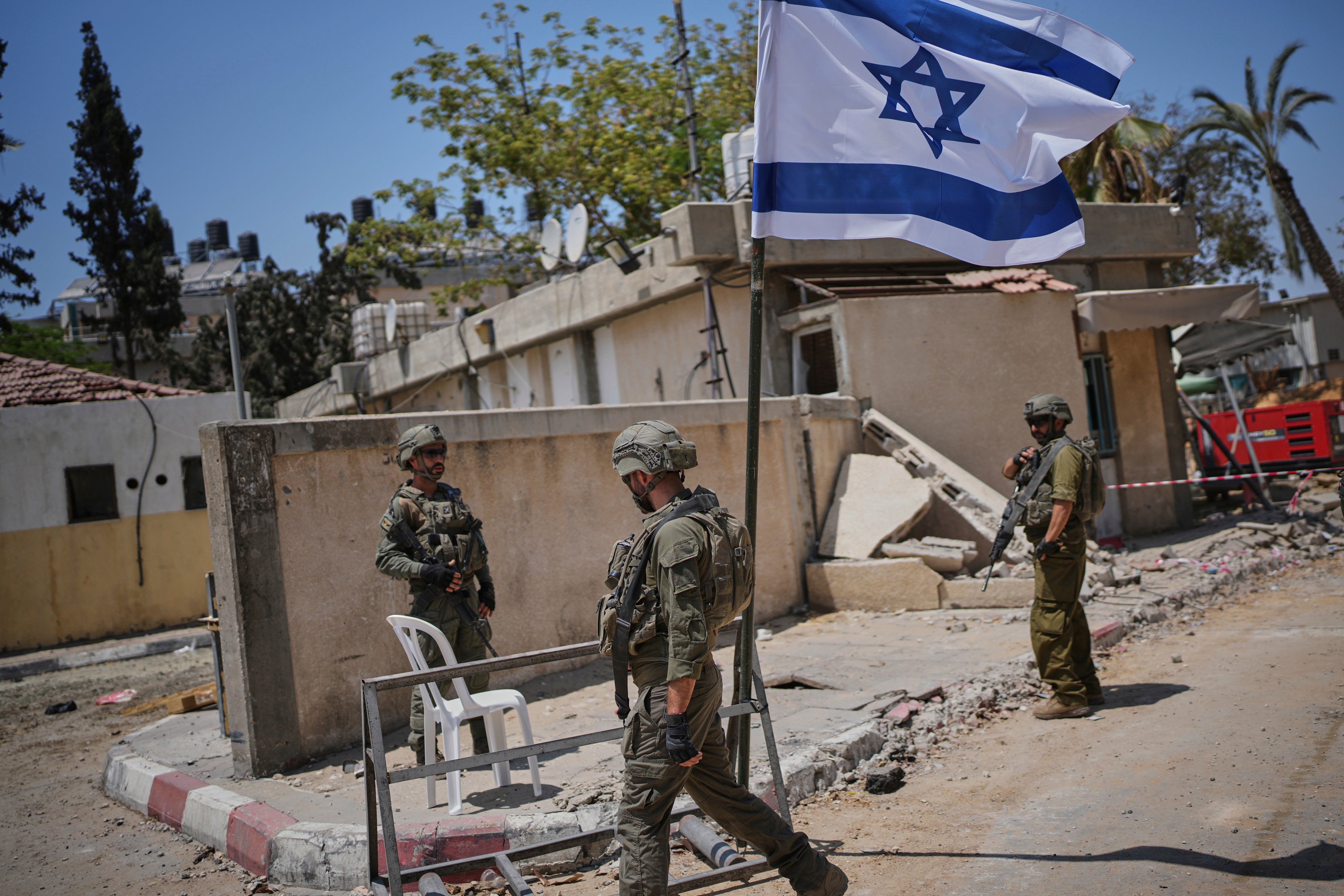 Israeli soldiers take up position at the European Hospital in Khan Younis, southern Gaza, on 8 June. The military claims that Hamas militants operated in a tunnel beneath the facility