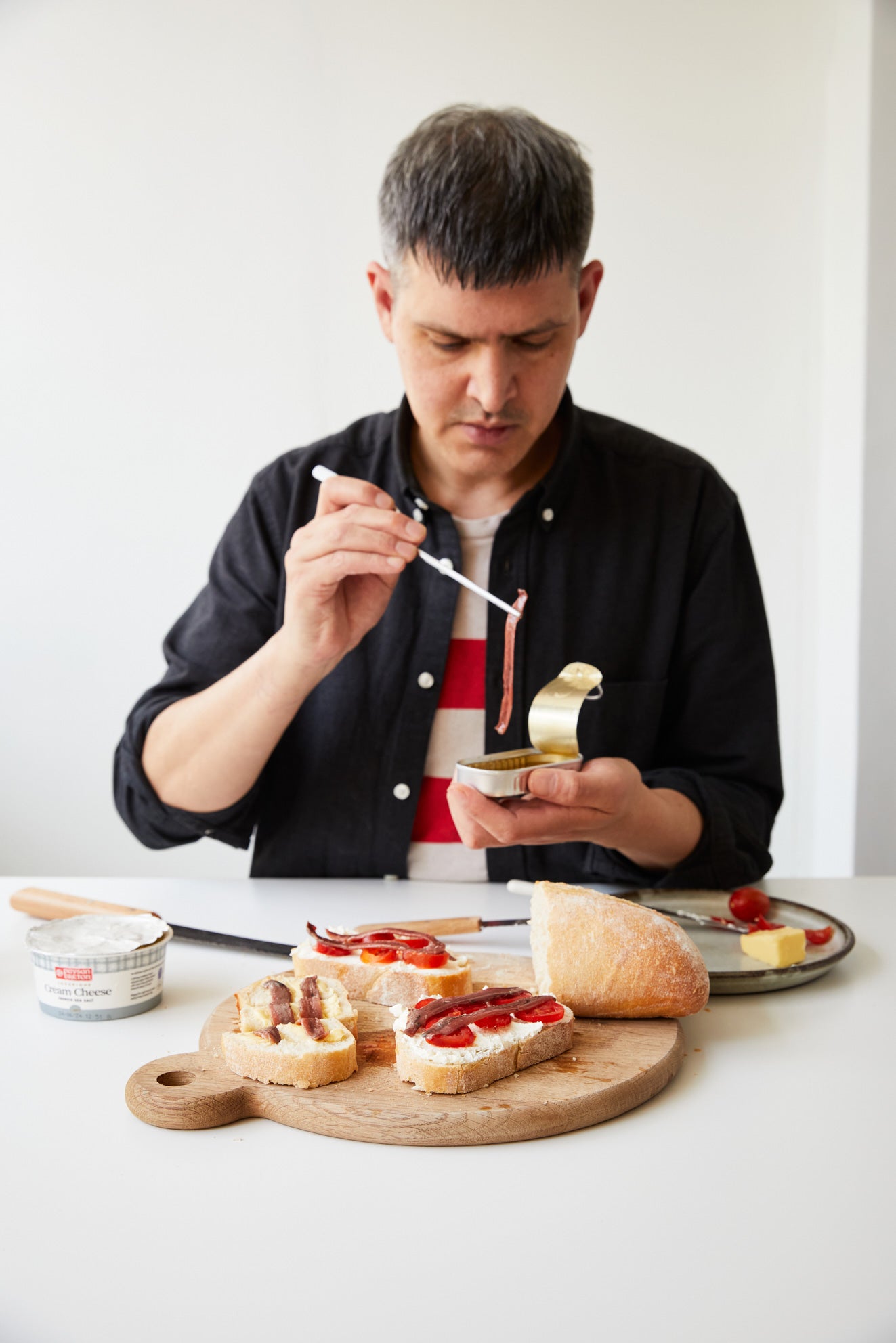 Good tinned fish needs little fuss — a slice of bread, a slick of cream cheese and a tin opened with precision