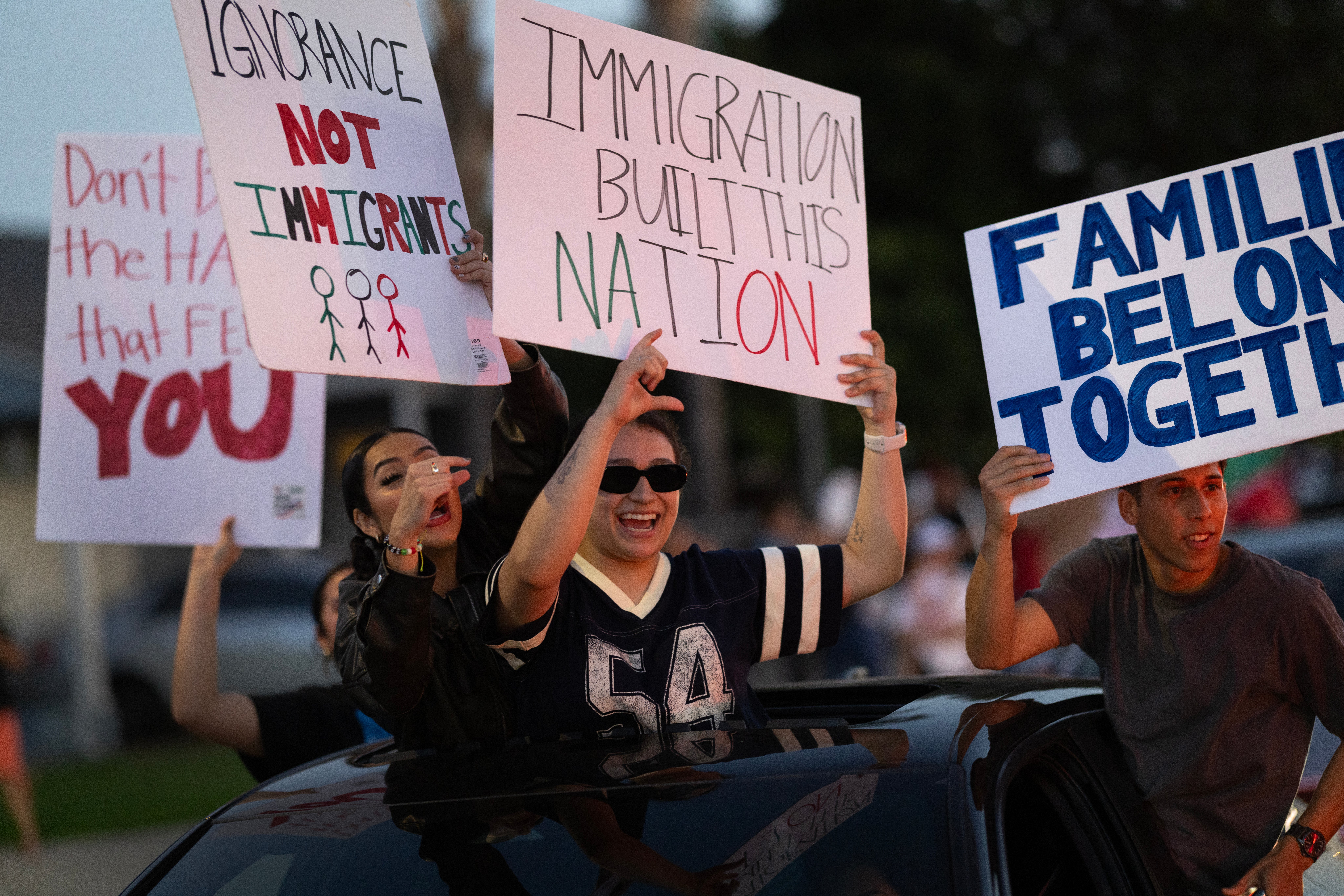 Demonstrators protest the Trump administration’s immigration agenda, which has seen more than 1 million legal immigrants ‘de-legalized’ through the president’s own policies, making them vulnerable for removal from the country