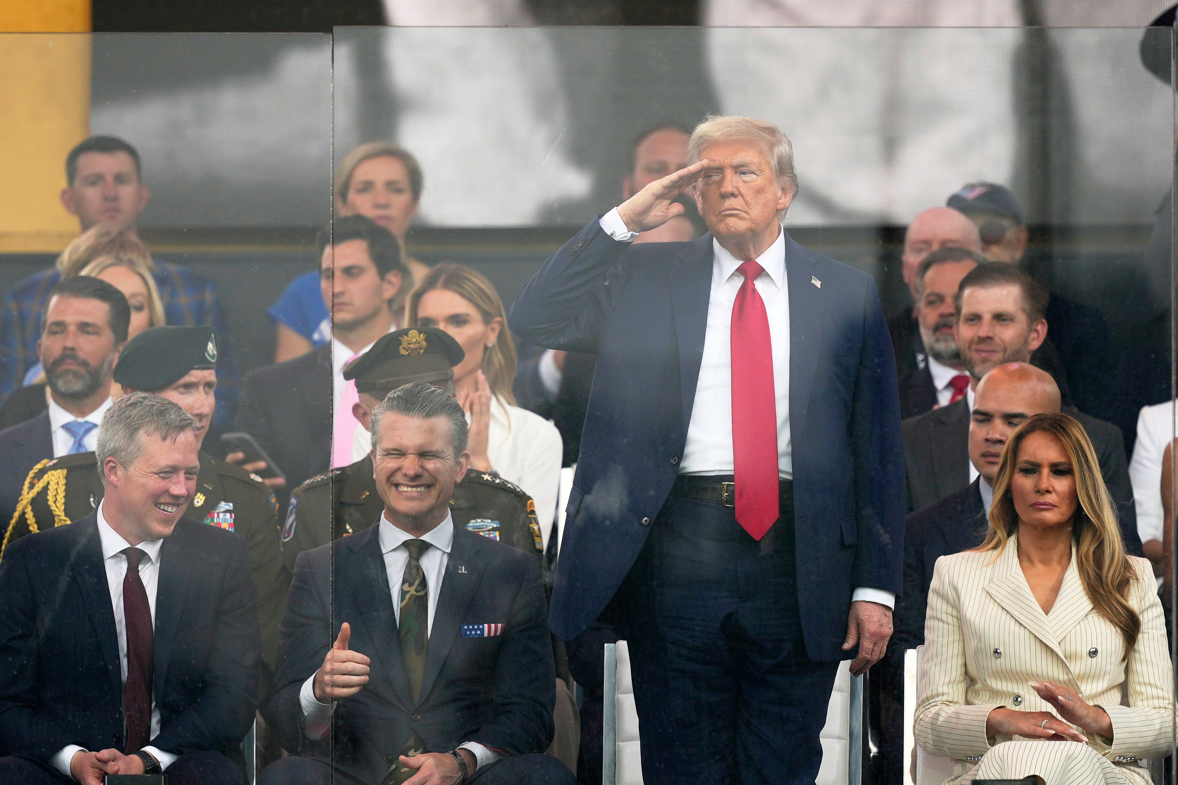 President Donald Trump salutes U.S. soldiers taking part in his costly military parade on Saturday June 14 2025