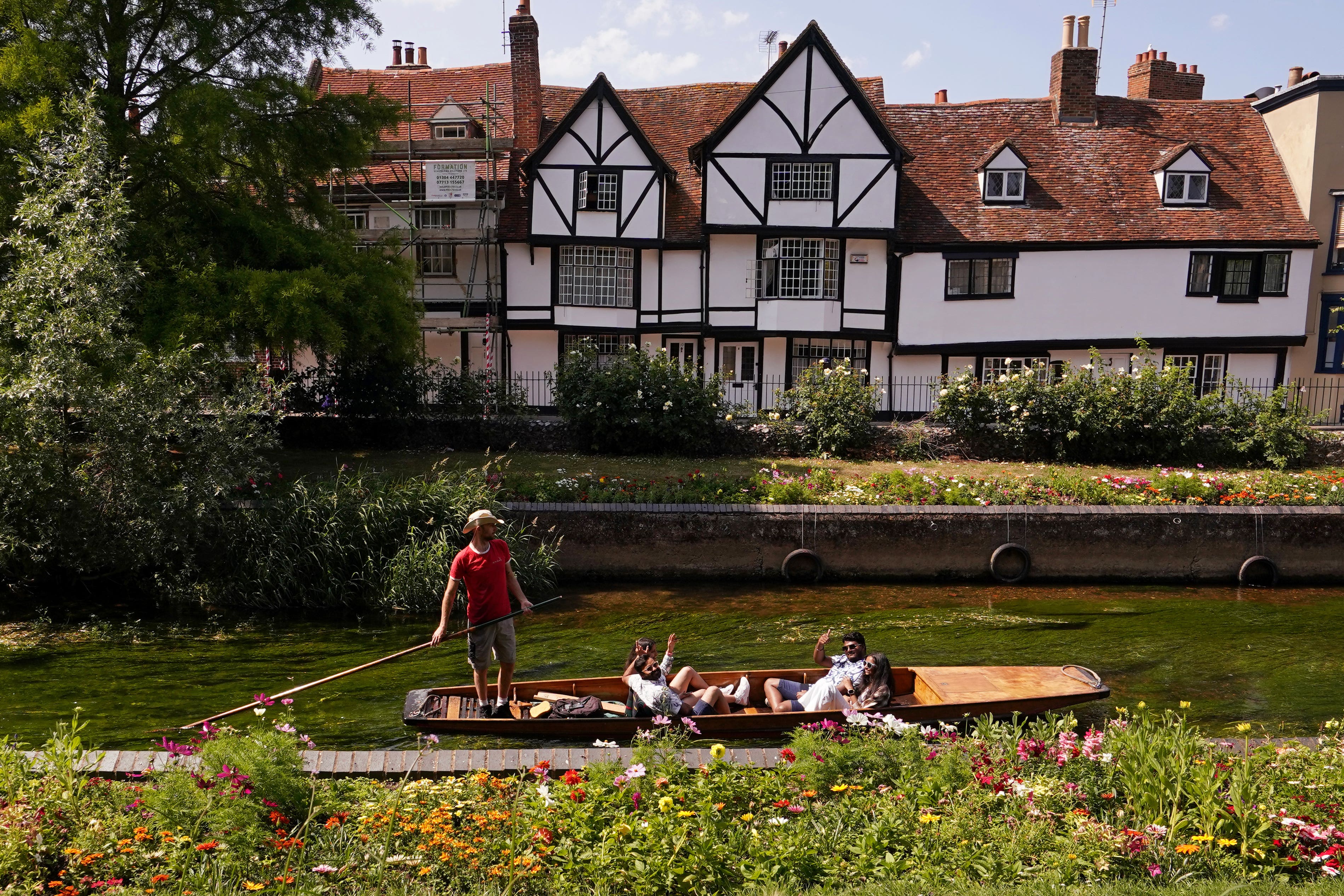 People enjoy punting through Westgate Gardens in Canterbury, Kent (Gareth Fuller/PA)