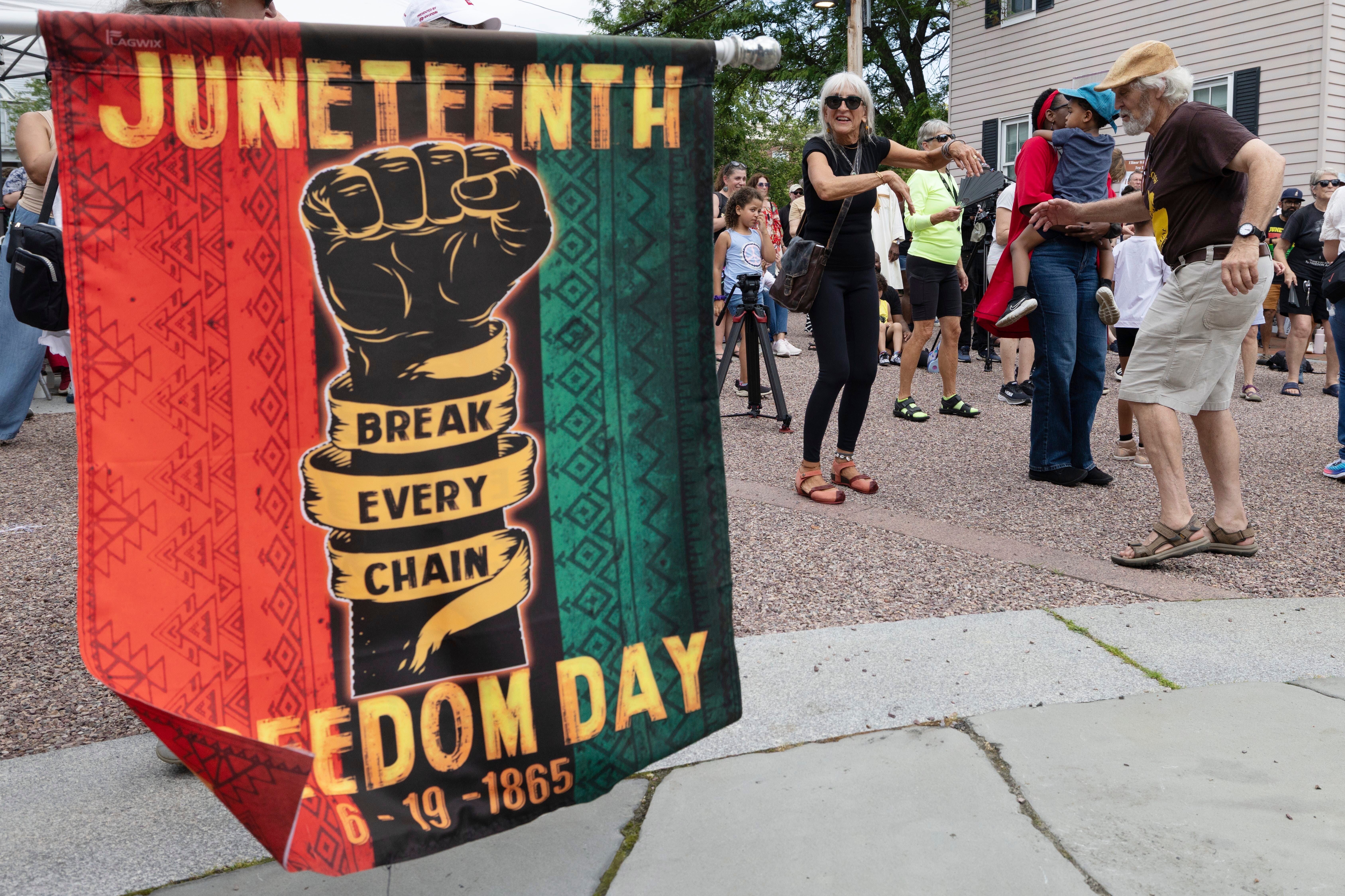 People dance during a Juneteenth celebration at the African Burying Ground Memorial Park in Portsmouth, New Hampshire, on Thursday June 19 2025