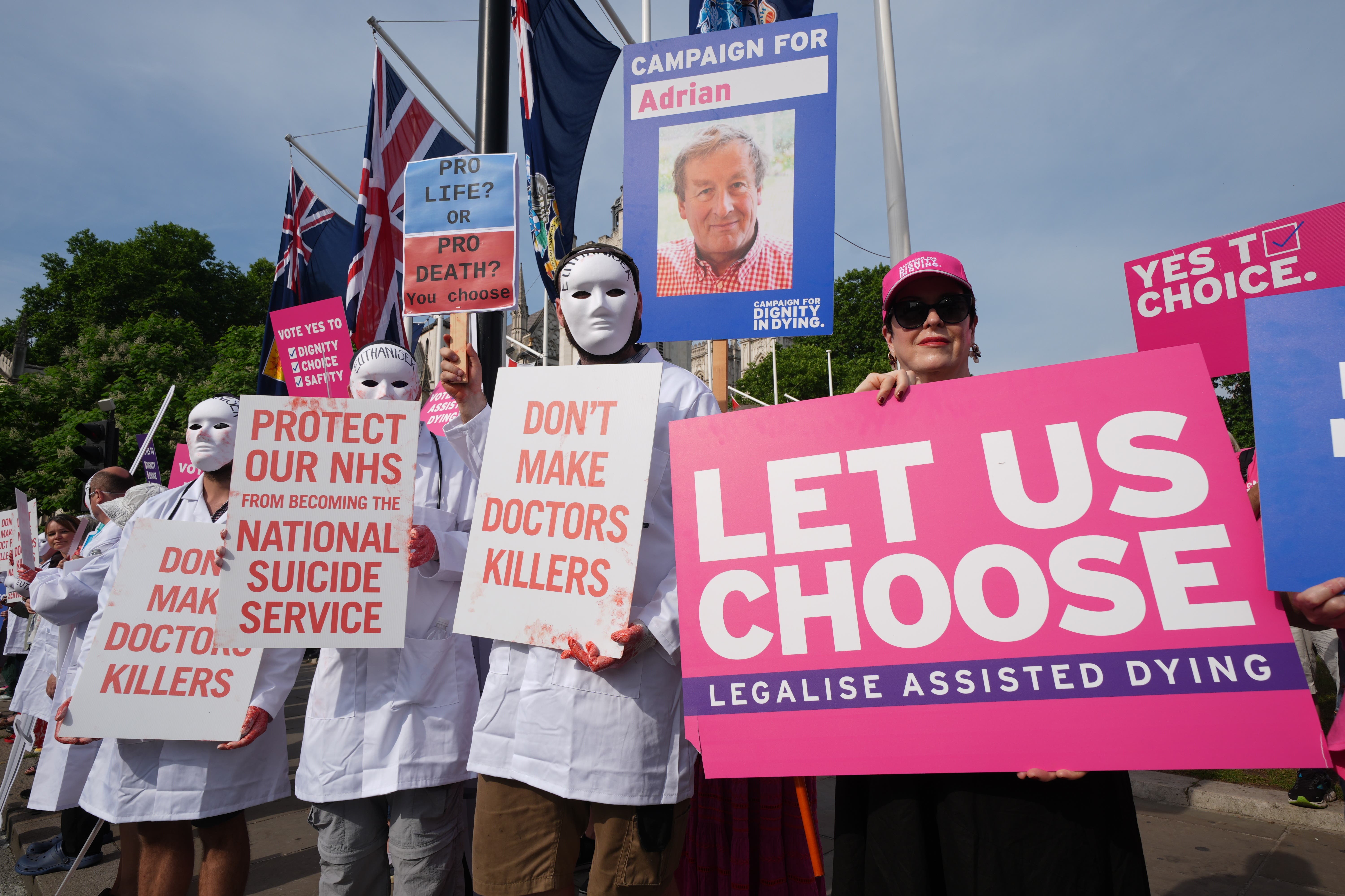 Campaigners supporting and opposing the assisted dying Bill demonstrate at Parliament Square, Westminster (Lucy North/PA)