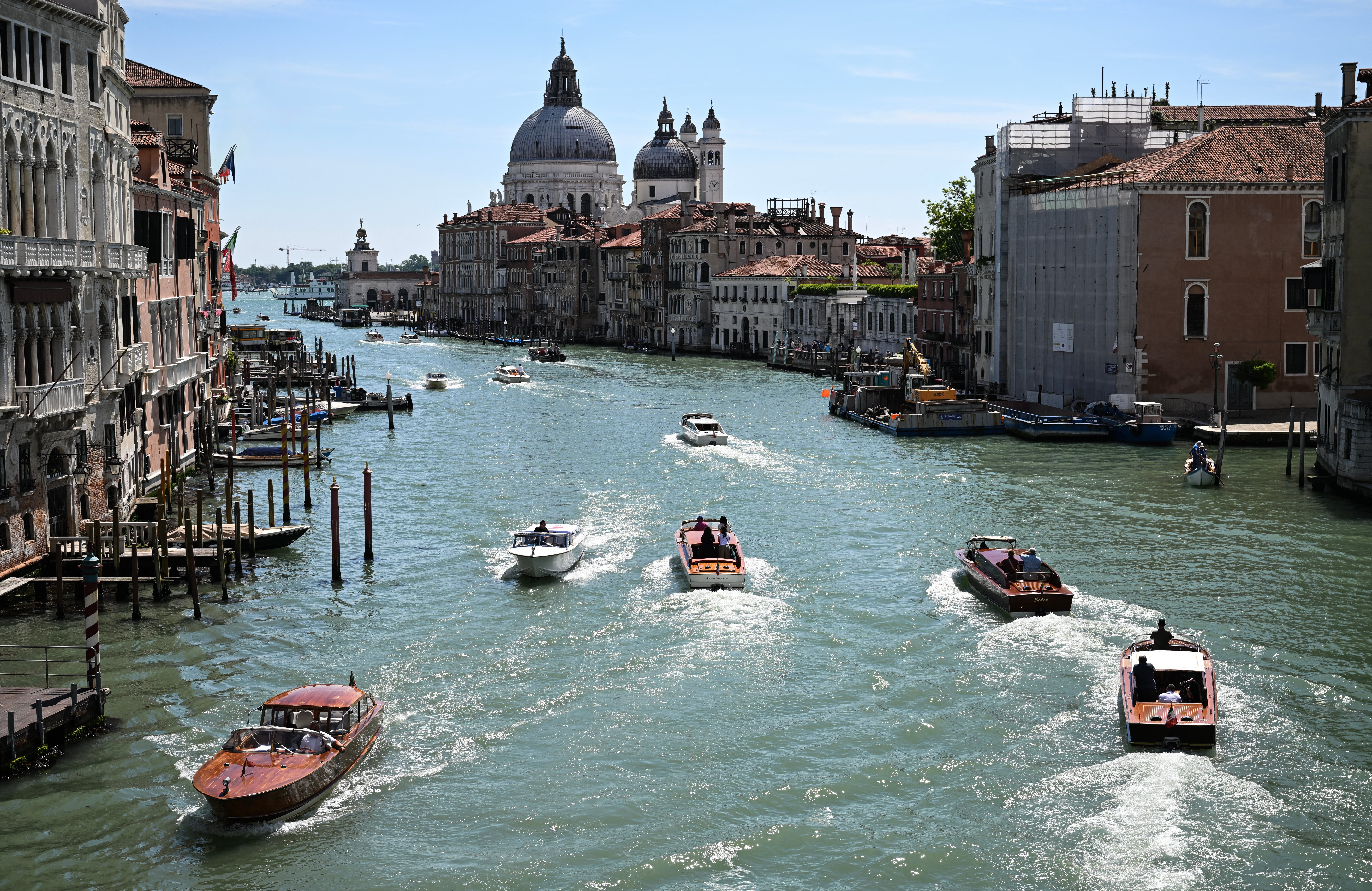 Water taxis navigate along the Grand Canal in Venice on May 29, 2025