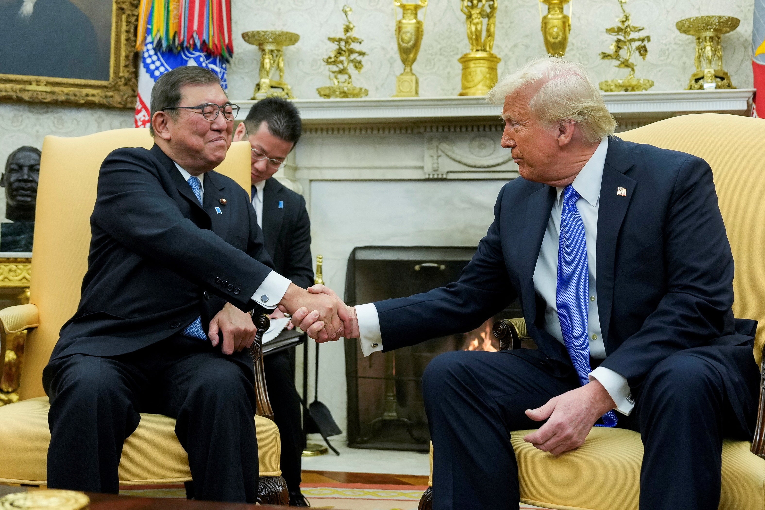 US president Donald Trump shakes hands with Ishiba during their first White House meeting on 7 February this year