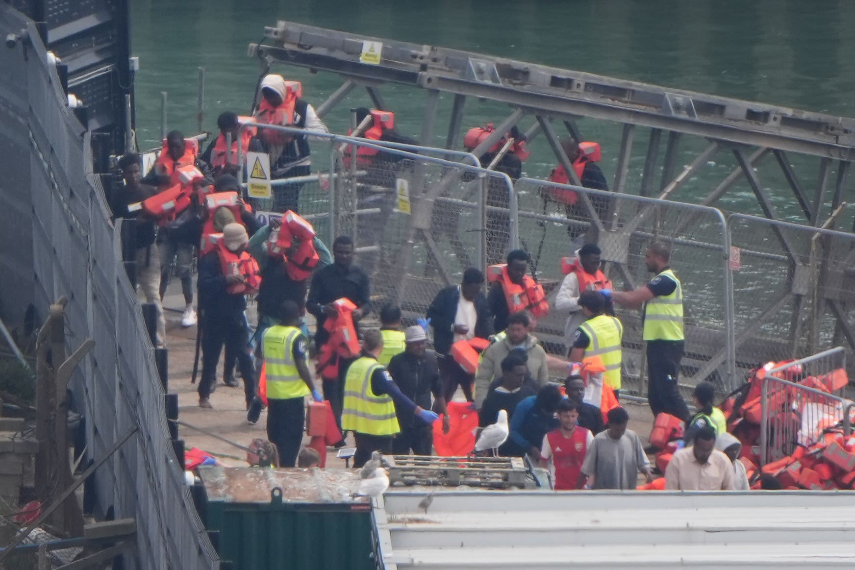 A group of people thought to be migrants are brought in to Dover (Gareth Fuller/PA)